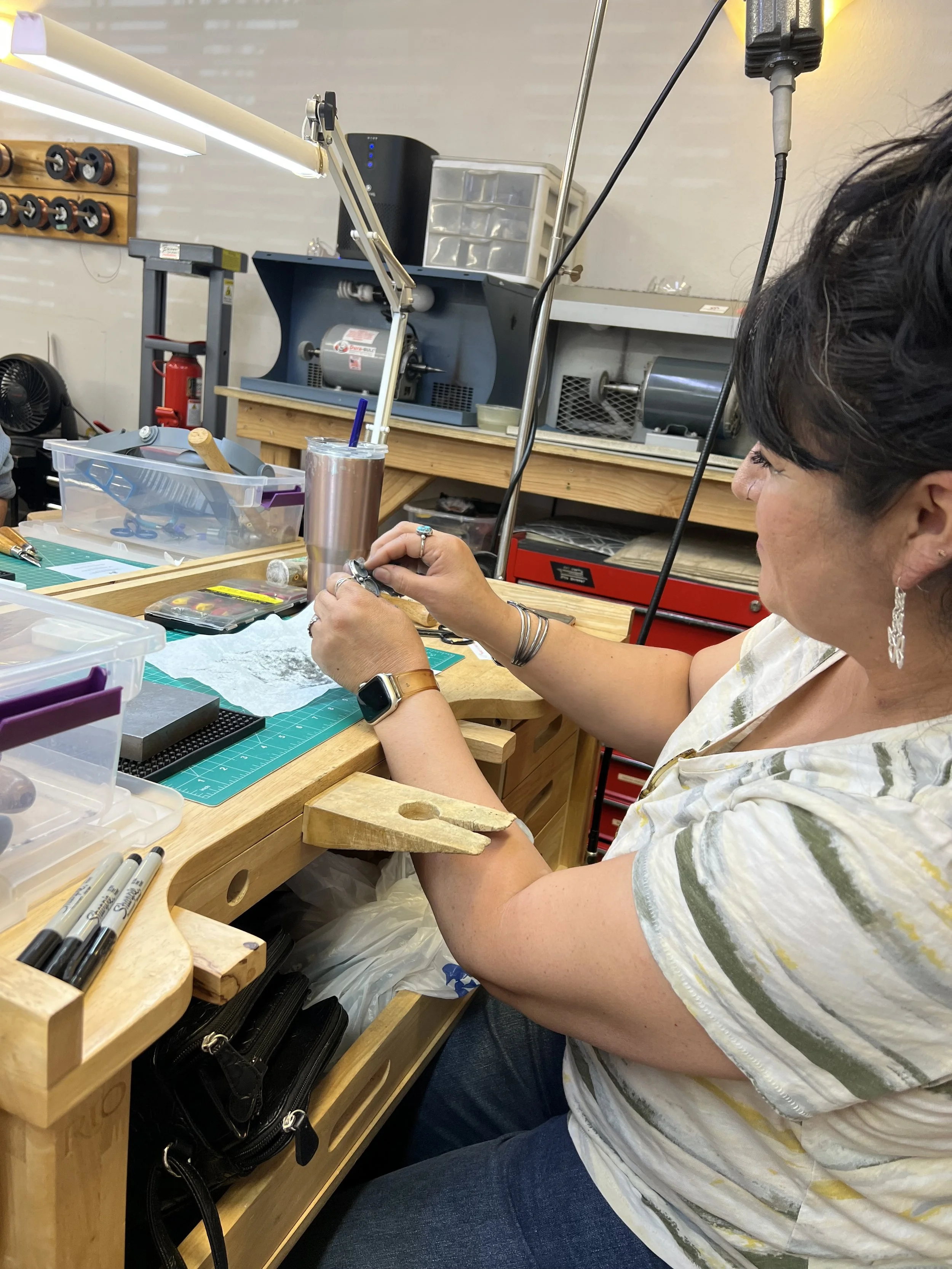 Student working with jewelry tools