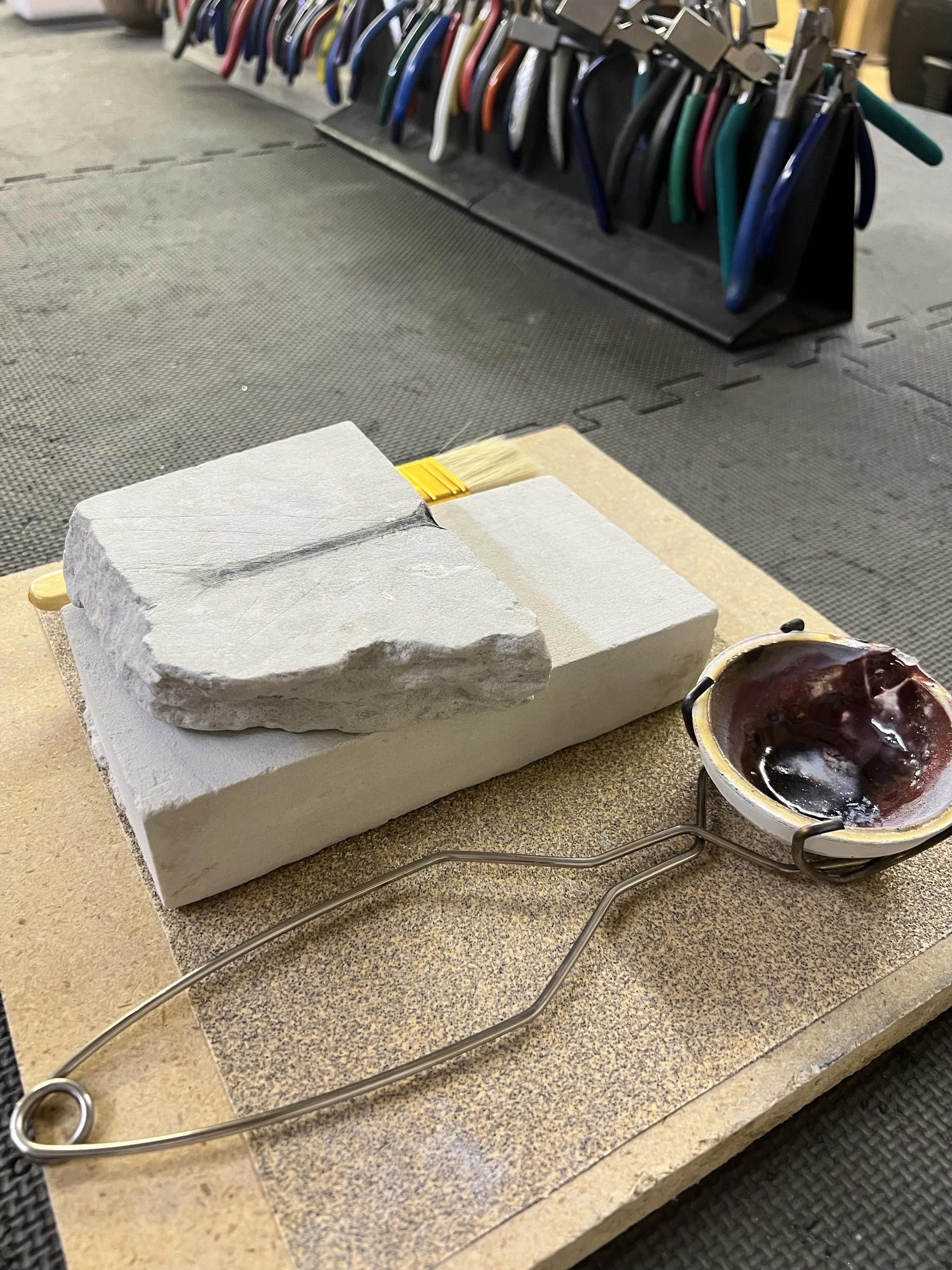 Wedding band materials and tools at the workbench
