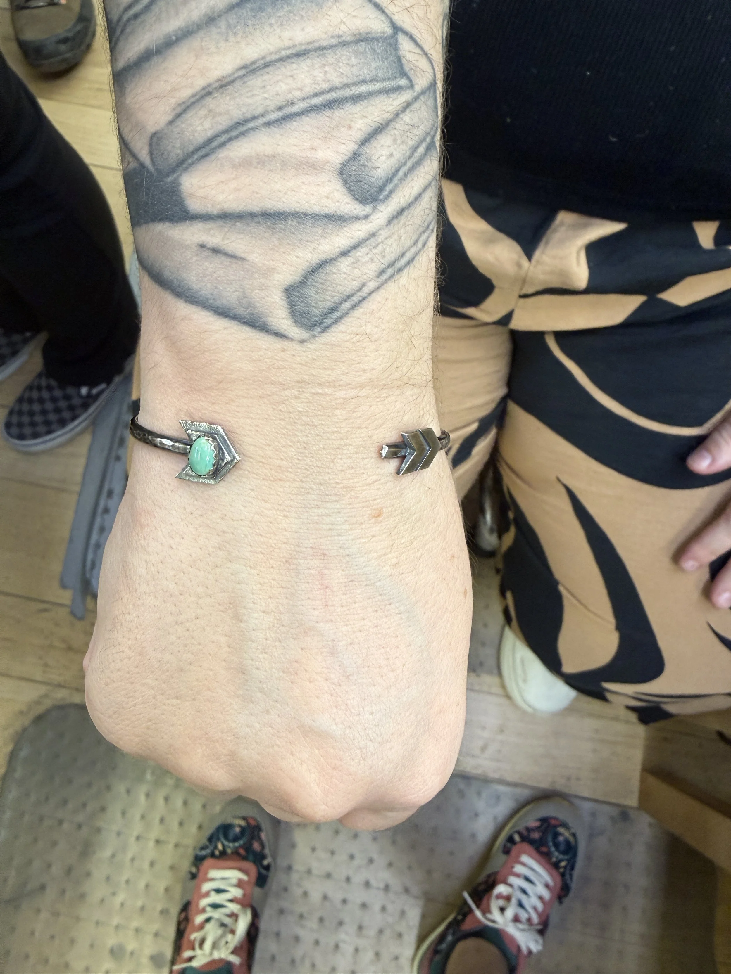 Student wearing a turquoise Arrow Cuff Bracelet