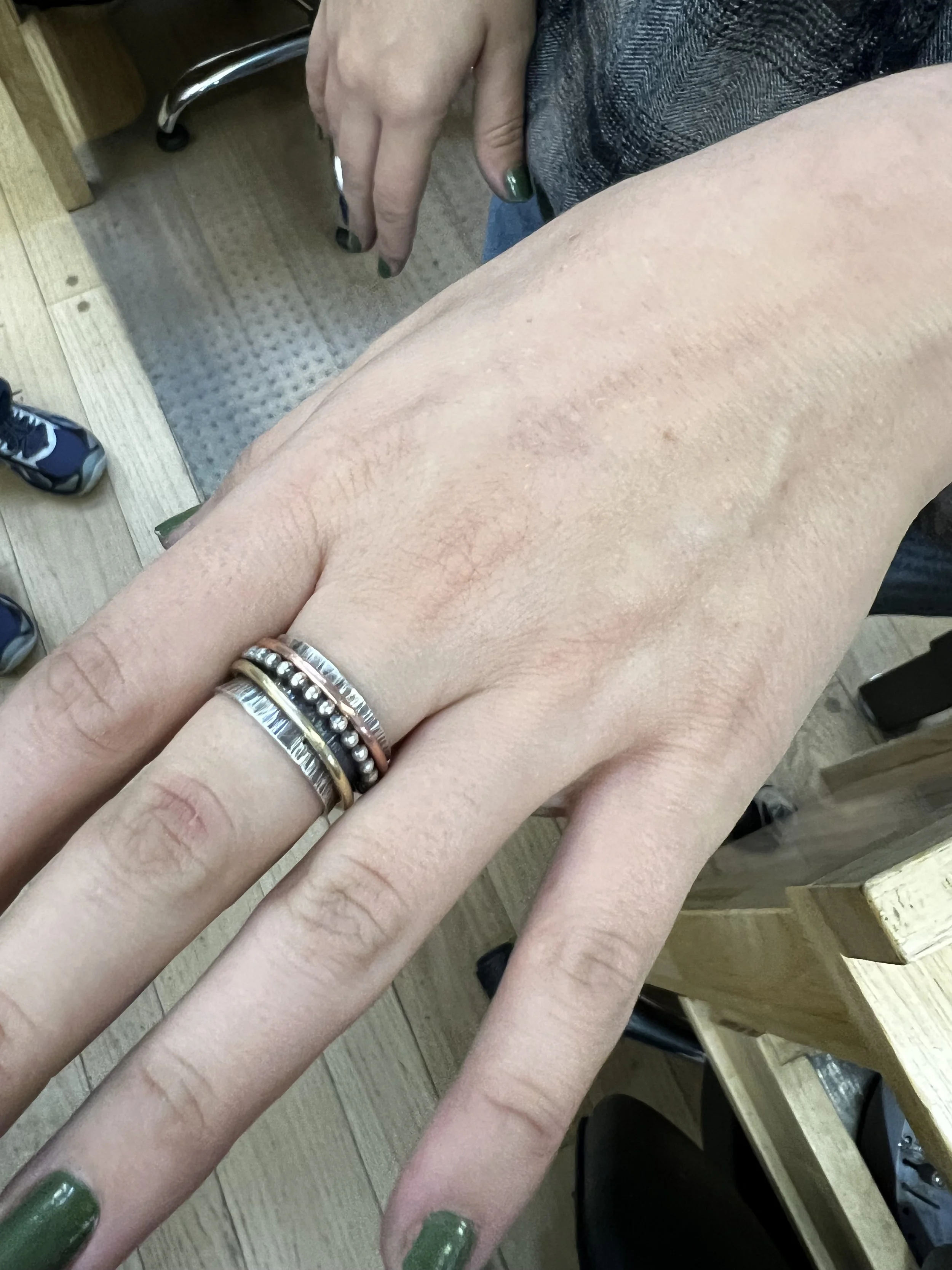 Student wearing her finished spinner ring
