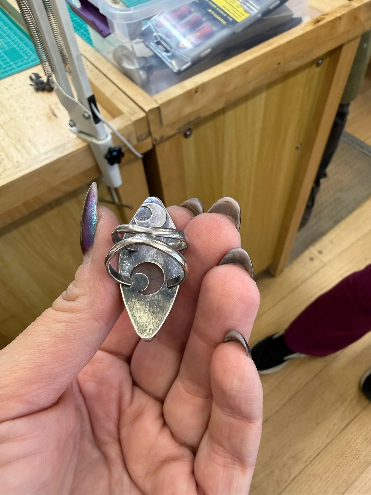 Finished handmade sterling silver Fall Statement Ring featuring a curved wire design