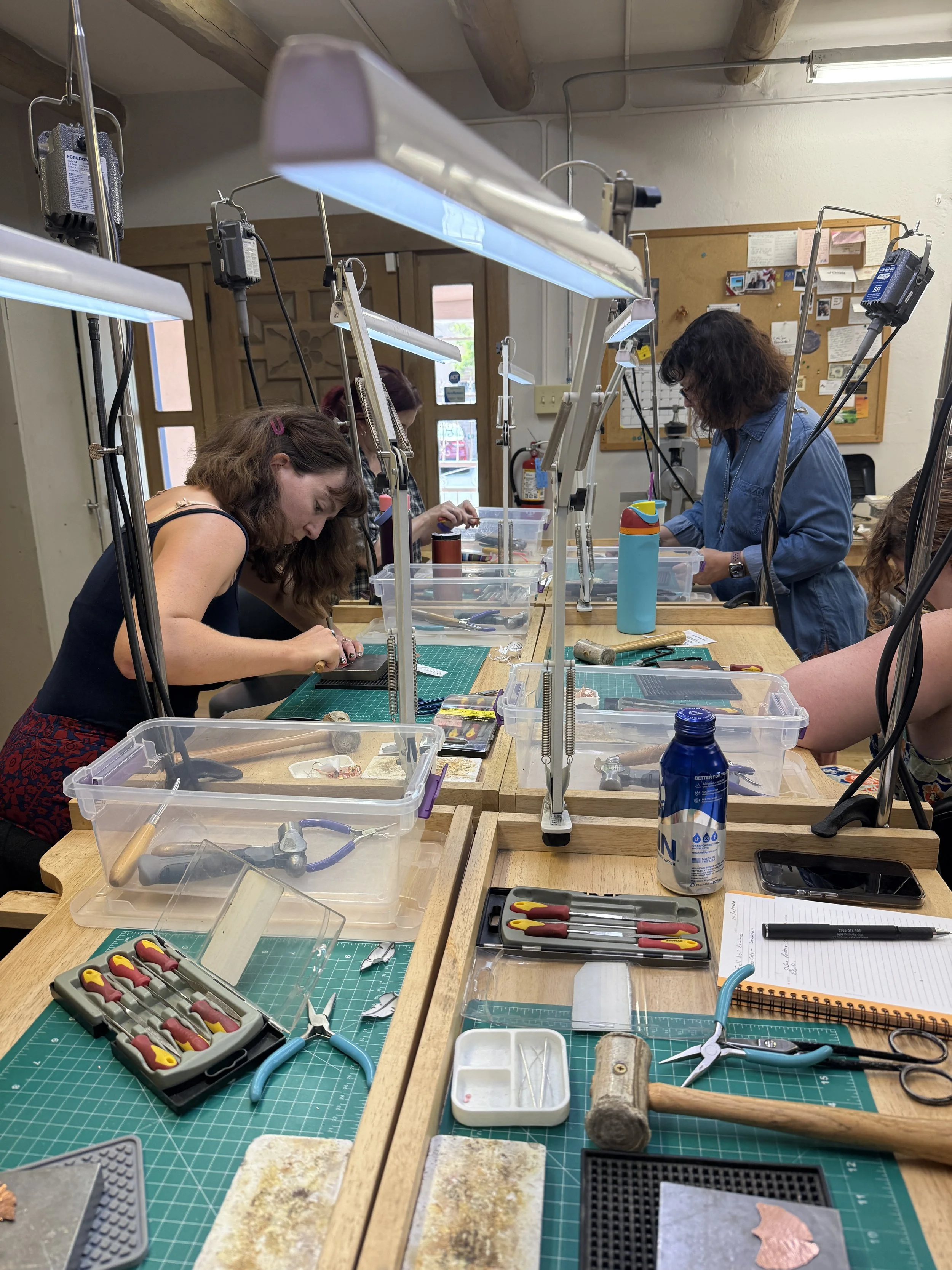 Students working on their handmade leaf earrings