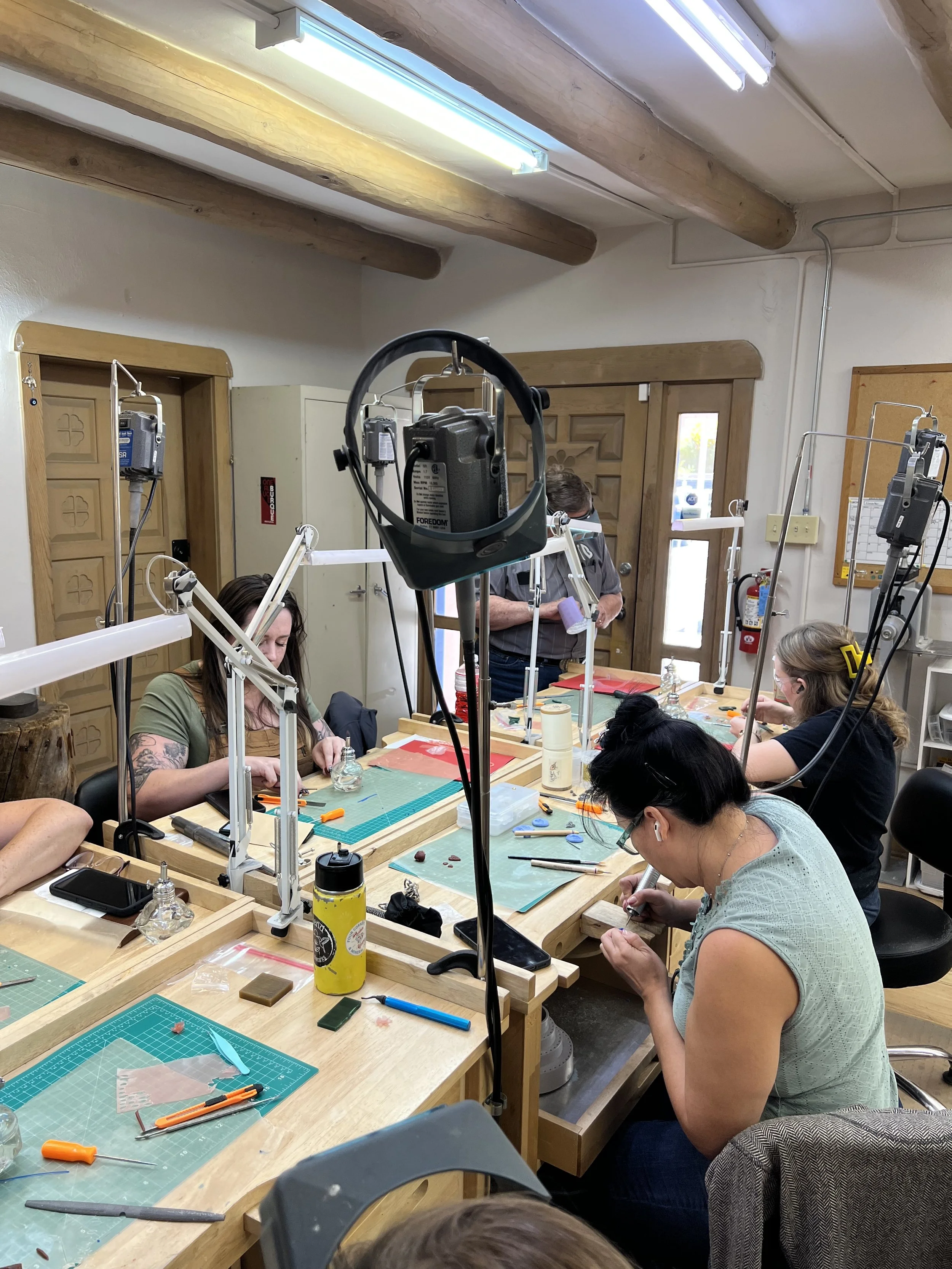 Groups learning jewelry-making techniques together in Albuquerque