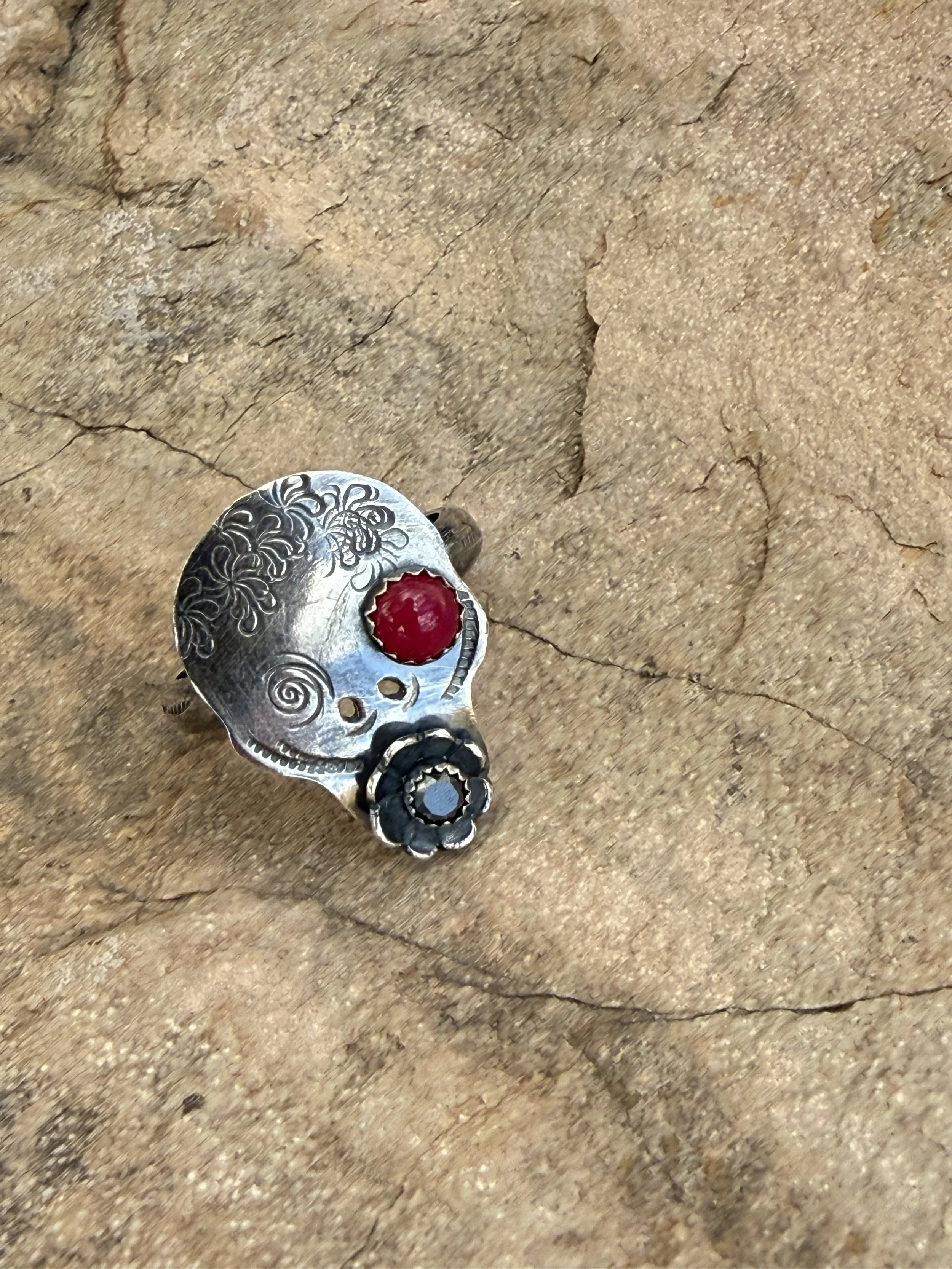 Sugar skull ring with colorful stone settings and decorative stamped patterns