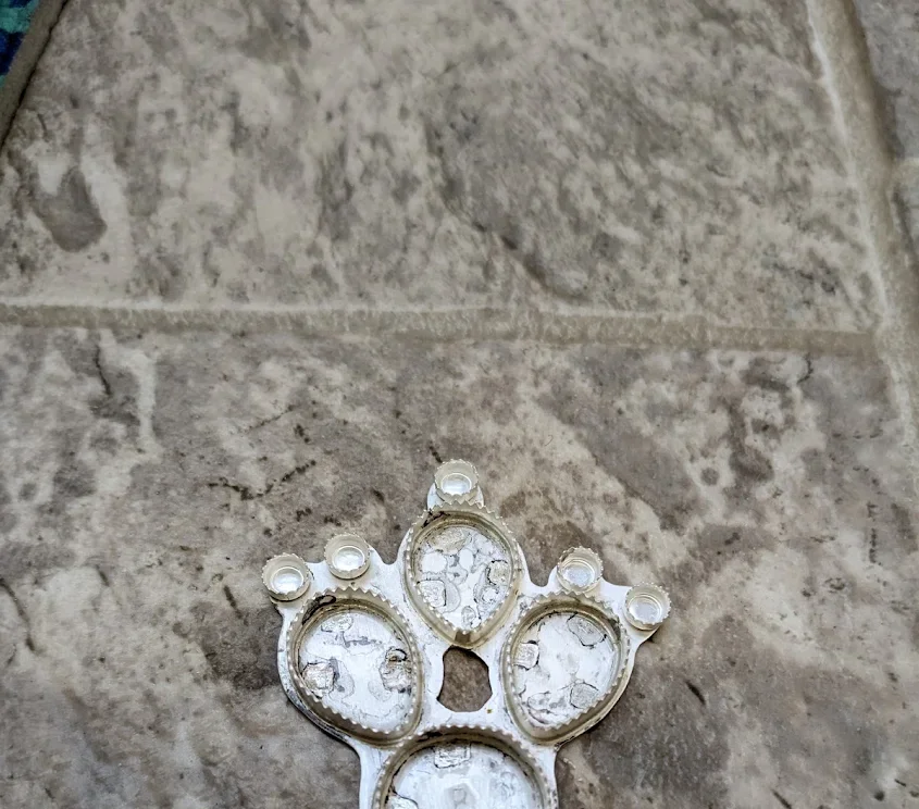 Unfinished silver jewelry setting with several stone bezels before the stones are set