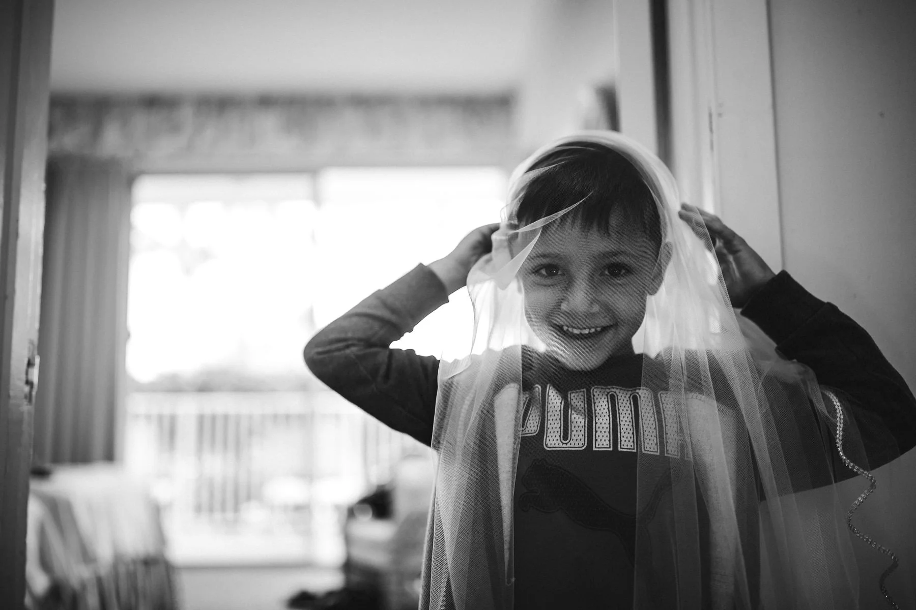 ring-bearer-antics-wedding-day-fun-tiny-house-photo-black-and-white.jpg