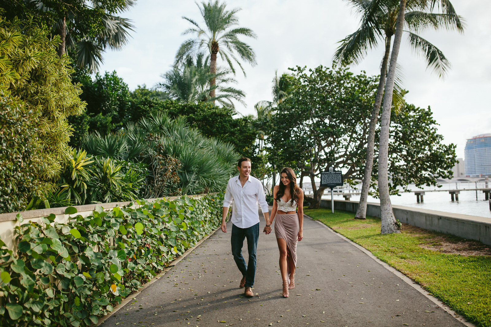 gorgeous couple walking near flagler museum in west palm beach
