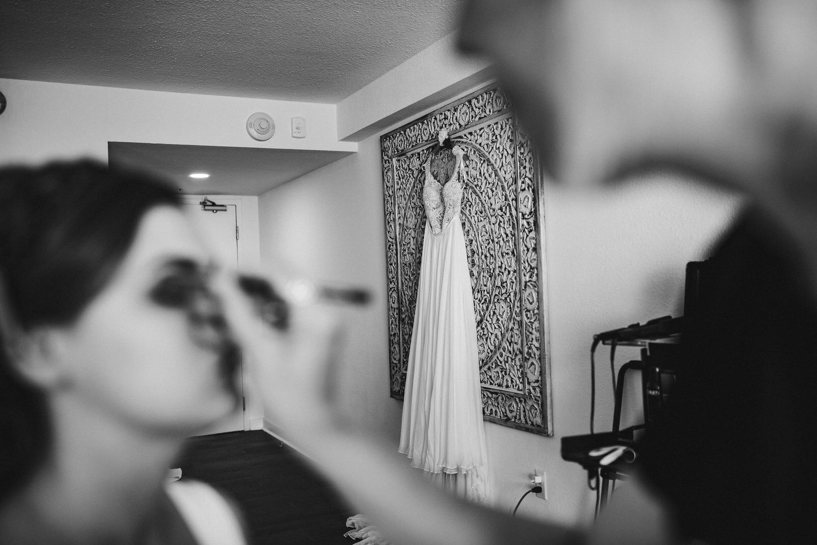 bridal_makeup_getting_ready_room_dress_hanging.jpg