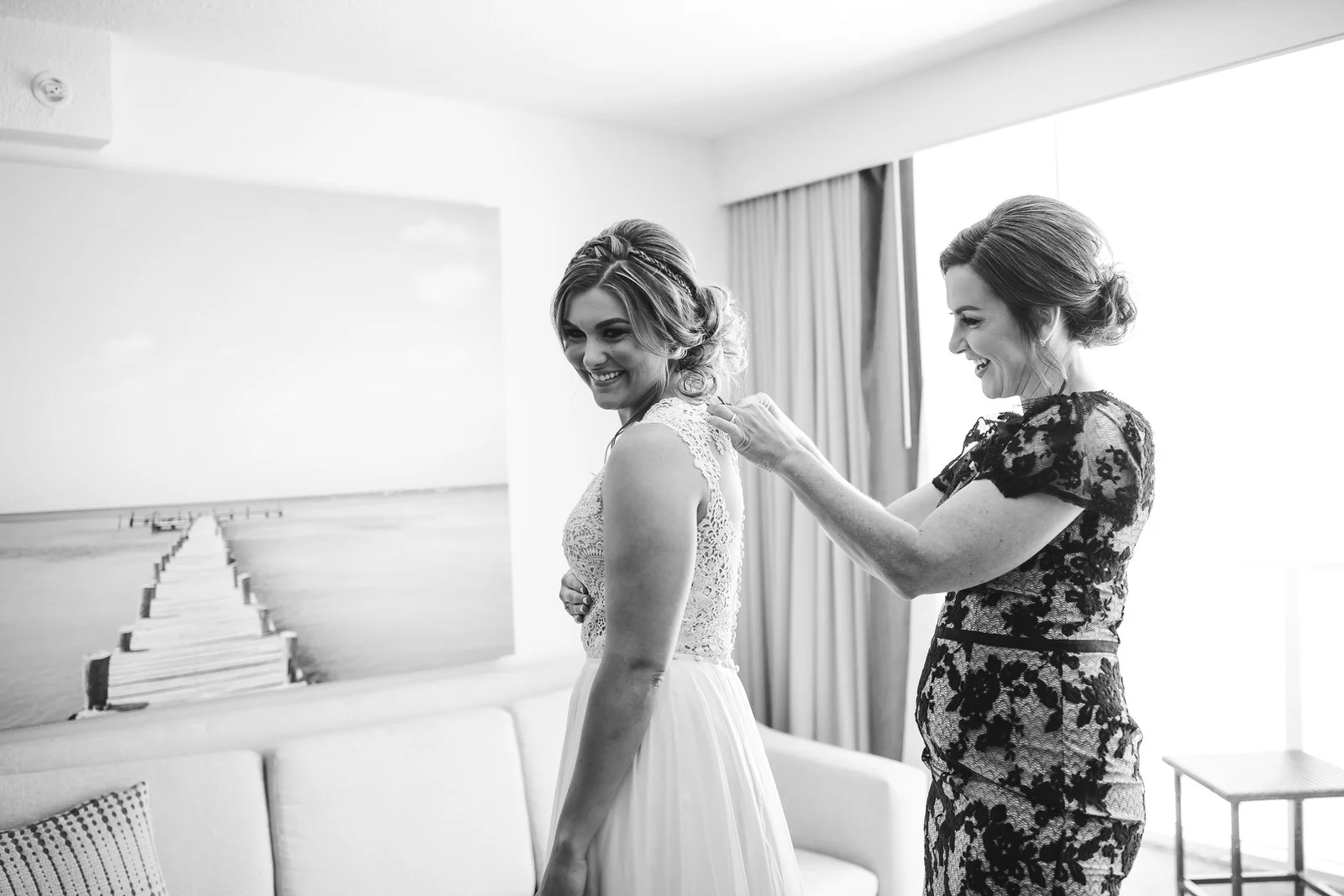 mom_helping_bride_in_dress_tiny_house_photo_lgbtq_wedding_photographer.jpg