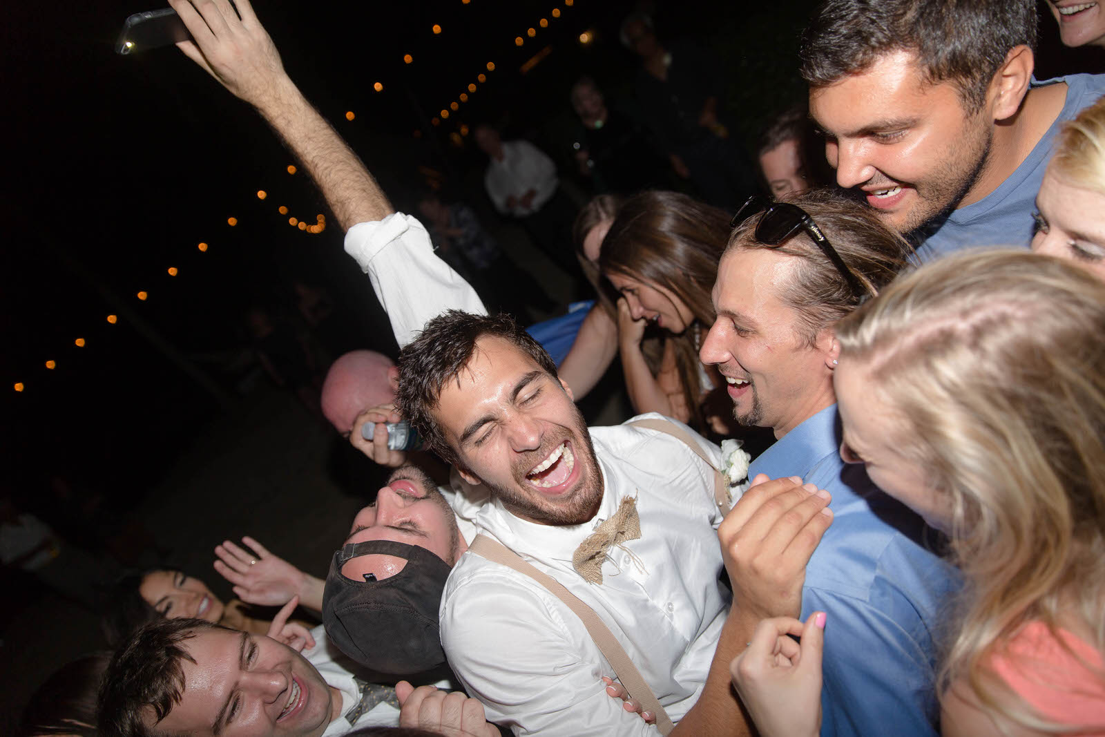 groom_fun_laughing_wedding_guests_drunk_reception.jpg