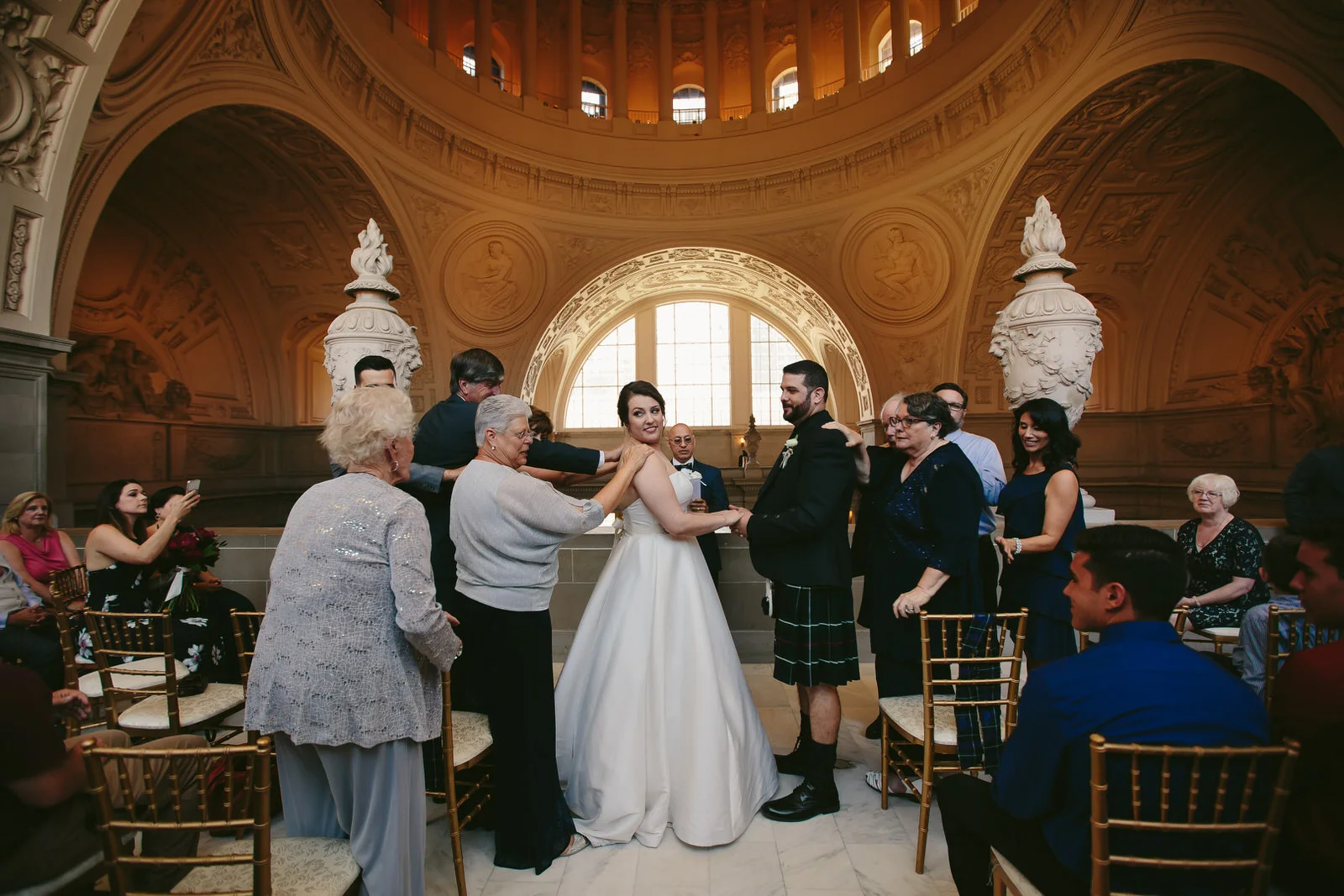 touching_embrace_wedding_san_francisco_city_hall_intimate_wedding.jpg