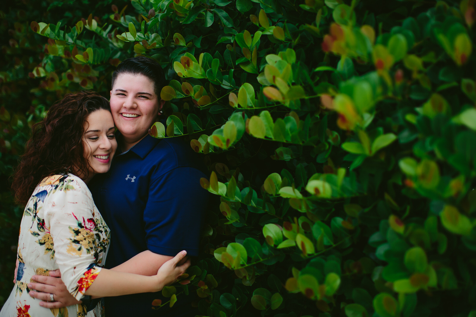 Cute Lesbian Couple holding each other in a woodsy area Hollywood Florida