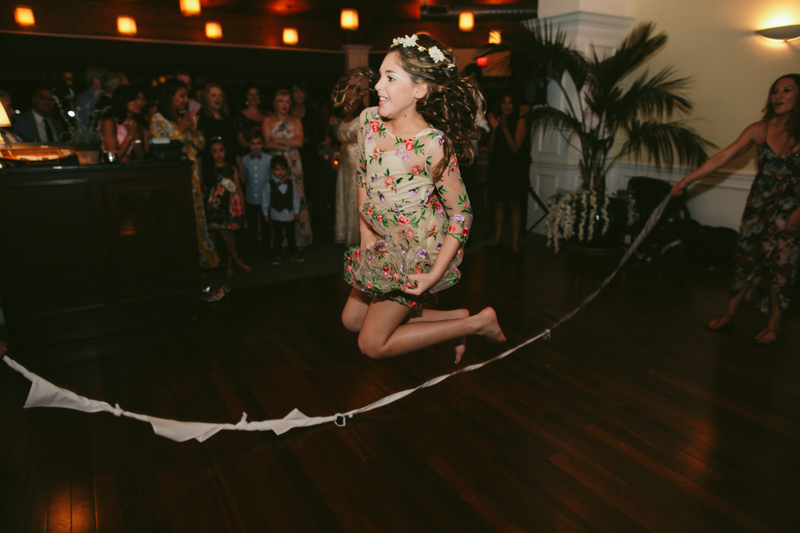 playing-jump-rope-wedding-reception-jensen-beach-wedding-photographer-tiny-house-photo