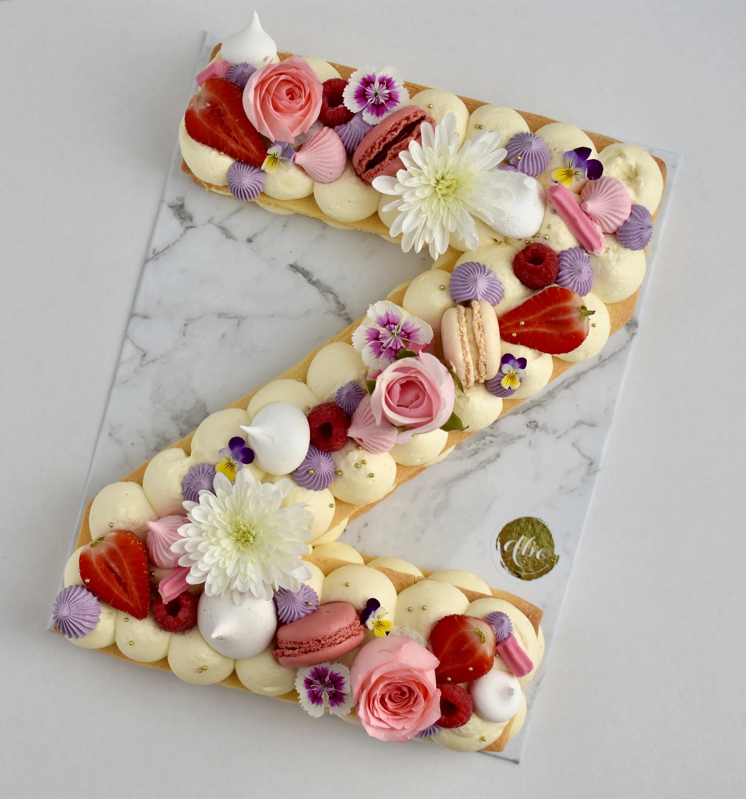 COOKIE CAKE Pate Sable with Cream Cheese Mousse or Two Toned Chocolate Mousse. Single Letter/Digit $89 11” to feed upto 15 THIS ITEM CONTAINS NUTS