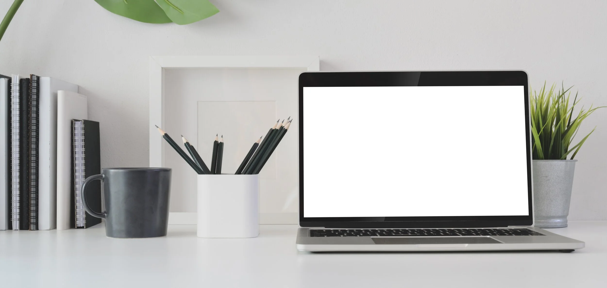 macbook-pro-on-white-table-3787619.jpg