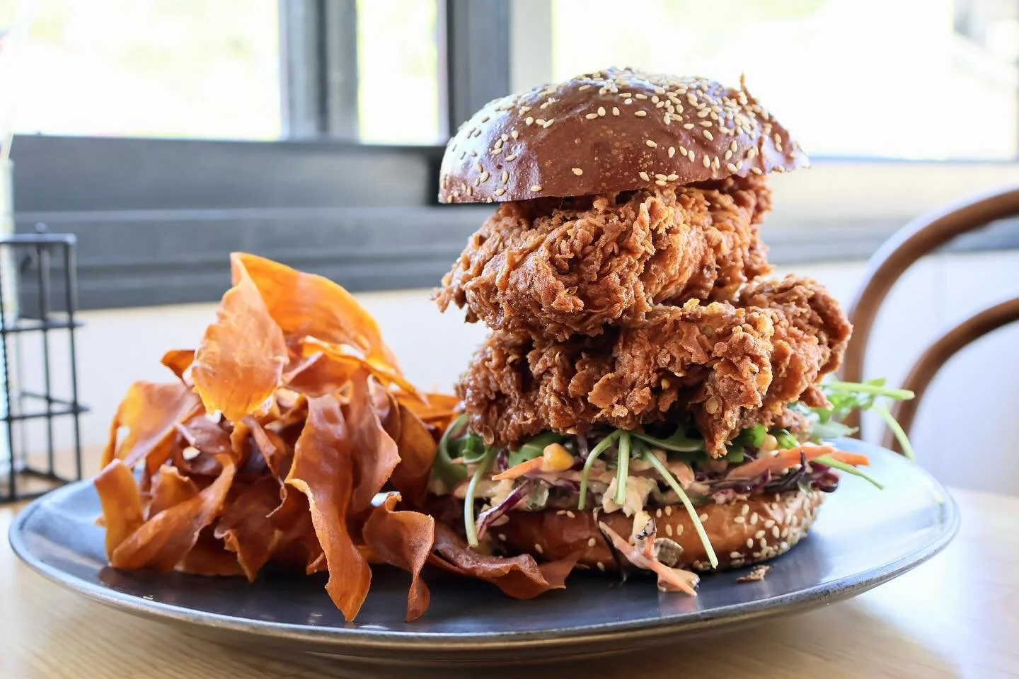 BUTTERMILK FRIED CHICKEN BURGER with spicy jalape&ntilde;o slaw, chipotle aioli on a brioche bun with sweet potato crisps.
.
.
.
.
#thelittlebanksia #southperth #kensington #perthcafe #pertheats #burgersinperth #perthfoodies #pertheats