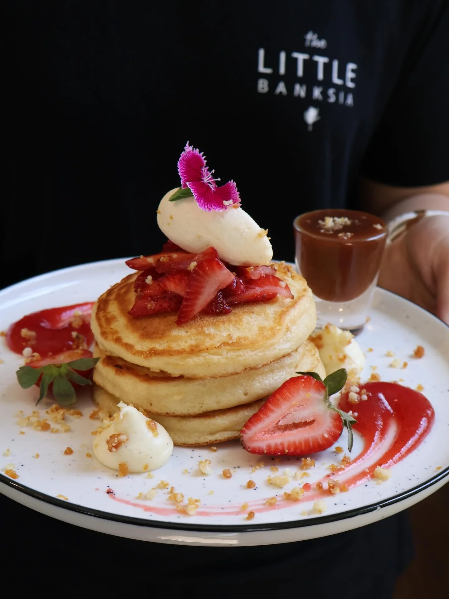 BUTTERMILK PANCAKES macerated strawberry, elderflower &amp; cr&egrave;me fraiche parfait, macadamia praline, vanilla cream, strawberry gel, salted caramel.
.
.
.
.
#thelittlebanksia #perthcafe #perthfood #pancakes #breakfastinperth #pertheats #perthe