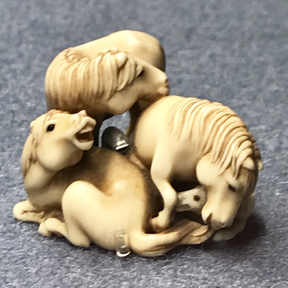 Netsuke: 3 horses and a foal 