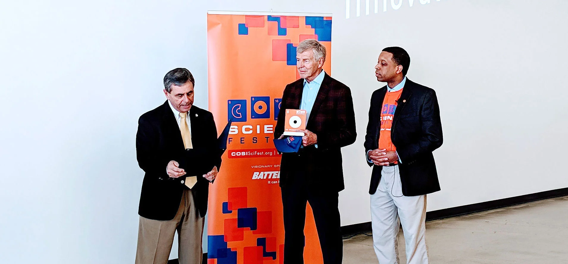 Gahanna Mayor Tom Kneeland reads his proclamation of March 15, 2019 as “EDGE Innovation Day”. Jim Grote, and Stephen White (COSI).