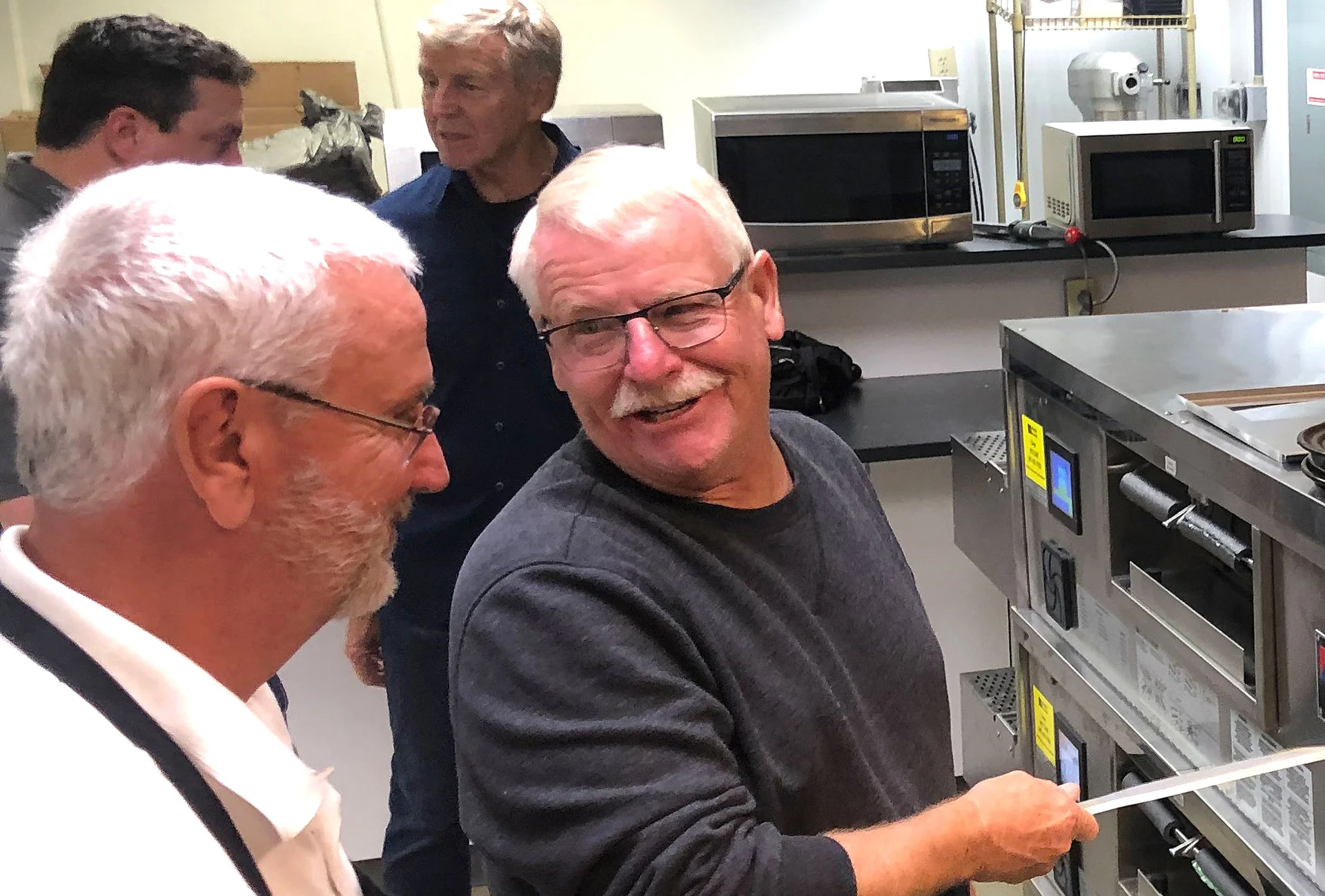 Roger Howard and Donice Fornaker conducting oven tests.
