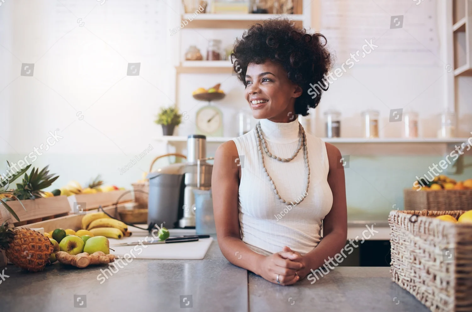 stock-photo-portrait-of-beautiful-young-woman-working-at-juice-bar-she-is-standing-behind-counter-looking-away-419352799.jpg
