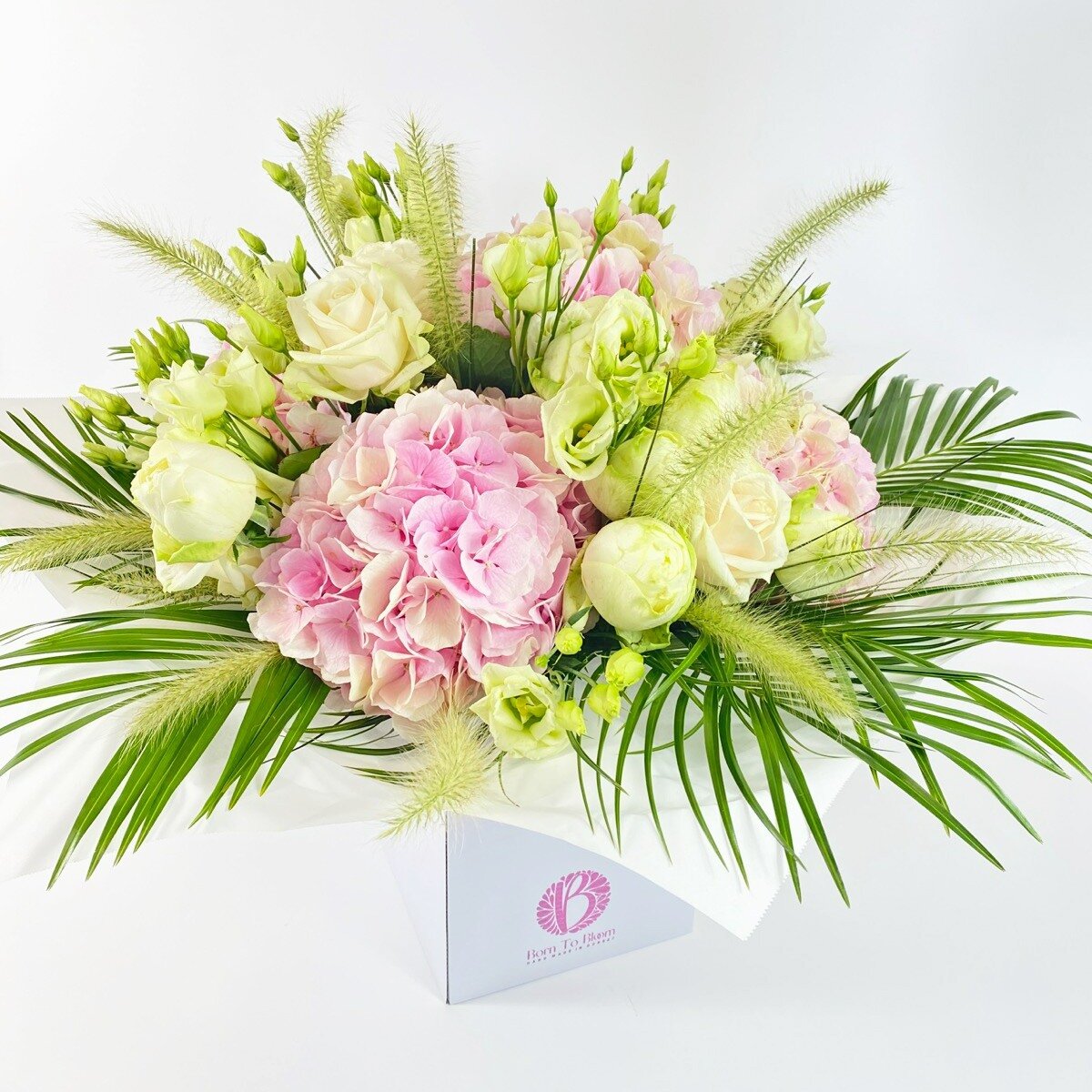 With Canford you are choosing the very best!

We will expertly design a stunning bouquet that may literally blow your socks off.

A gorgeous selection of top quality blooms in a soft pastel colour scheme featuring large headed roses, textural foliage