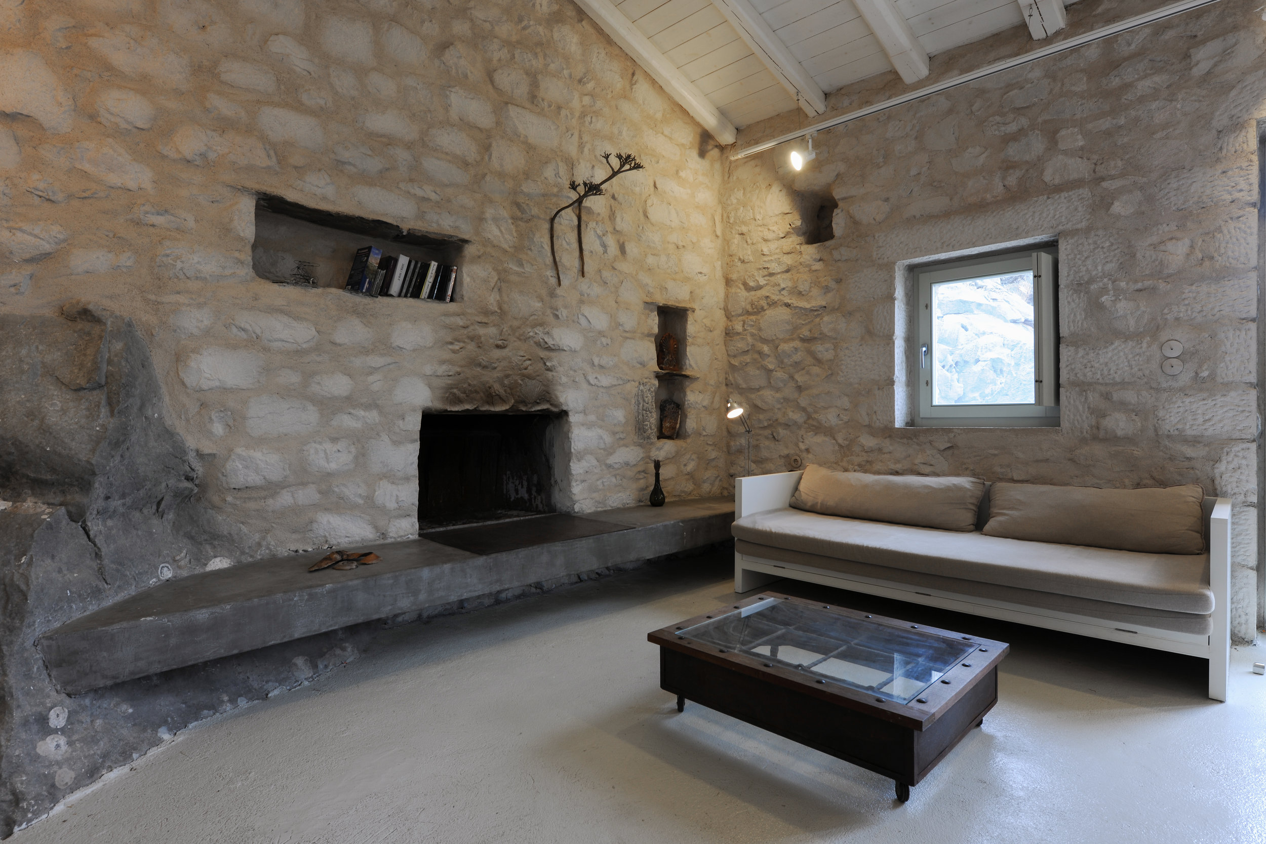 The sitting room has a fireplace and a sofa that can be converted to a double bed.