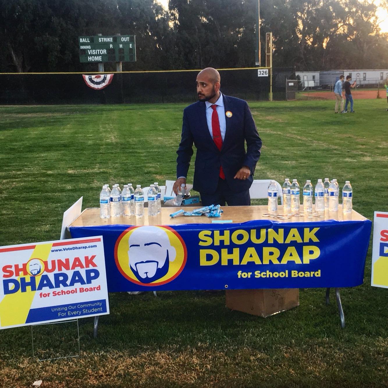 Handing out water and granola at the Moonlight Run and Walk during Shounak’s first campaign in 2018.