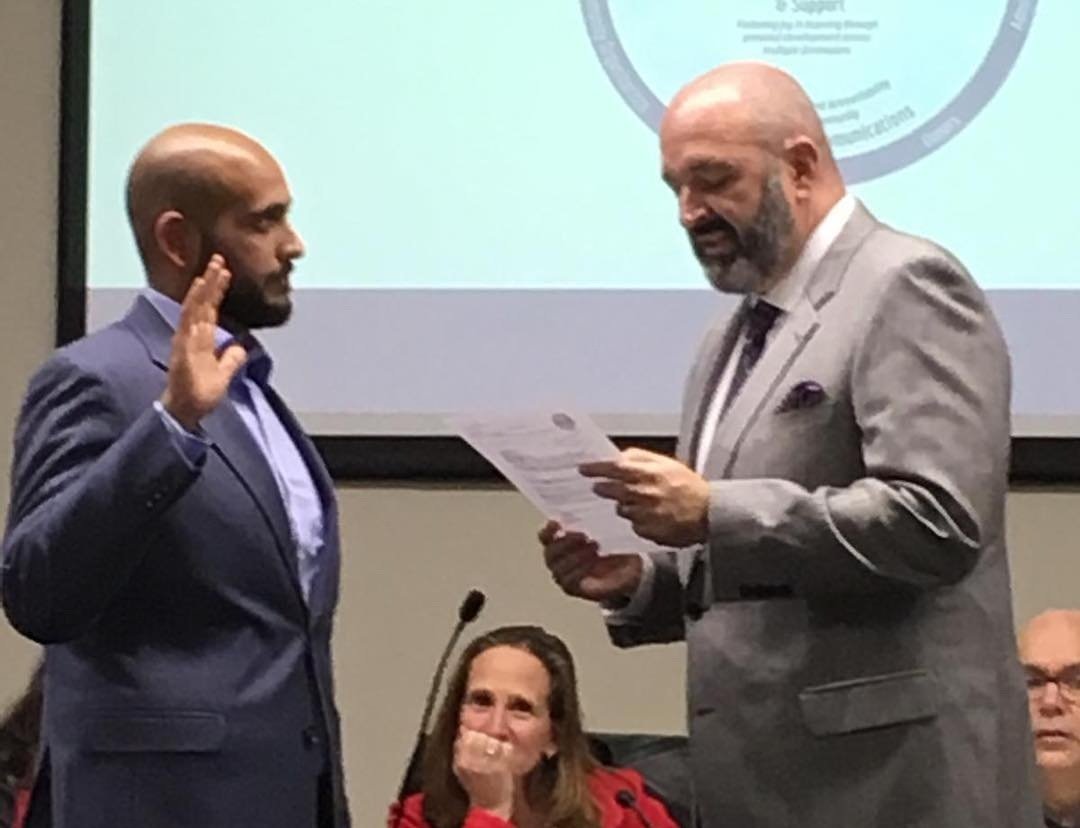 Taking the oath of office after being elected in 2018.