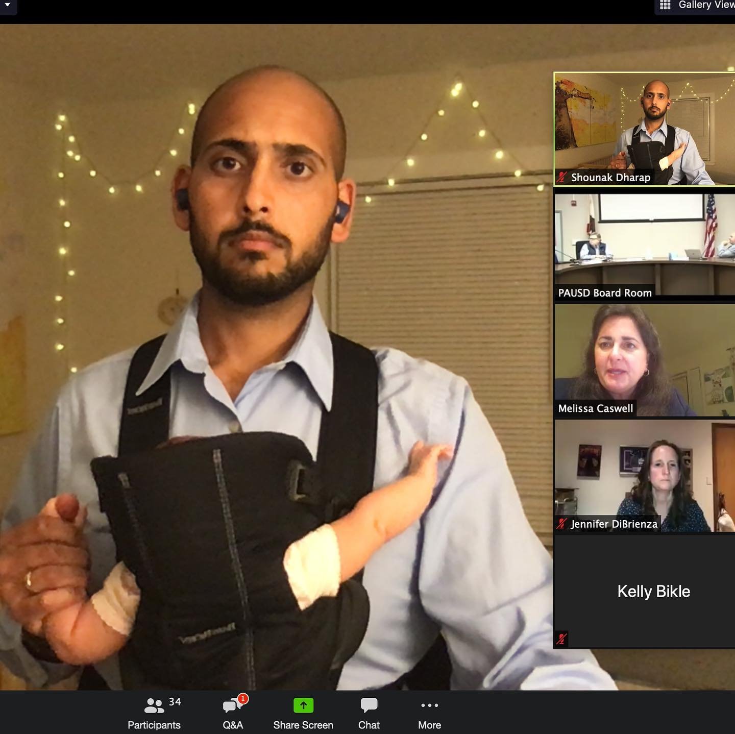 Holding newborn Aarchi during the first virtual board meeting in March 2020.