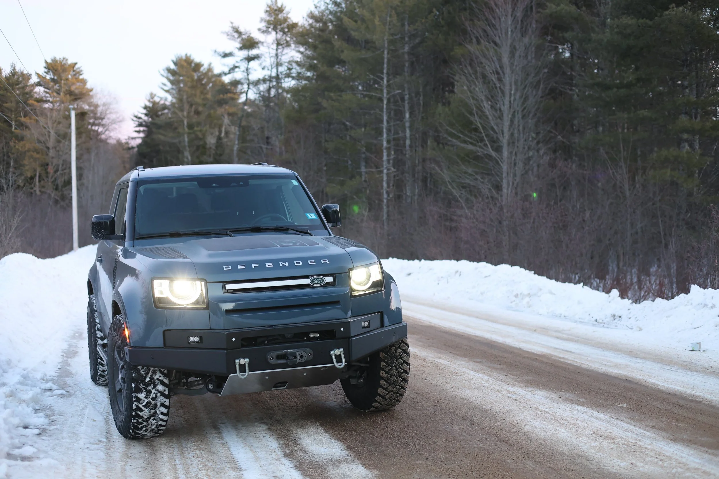New Defender L663 on a snowy Maine road