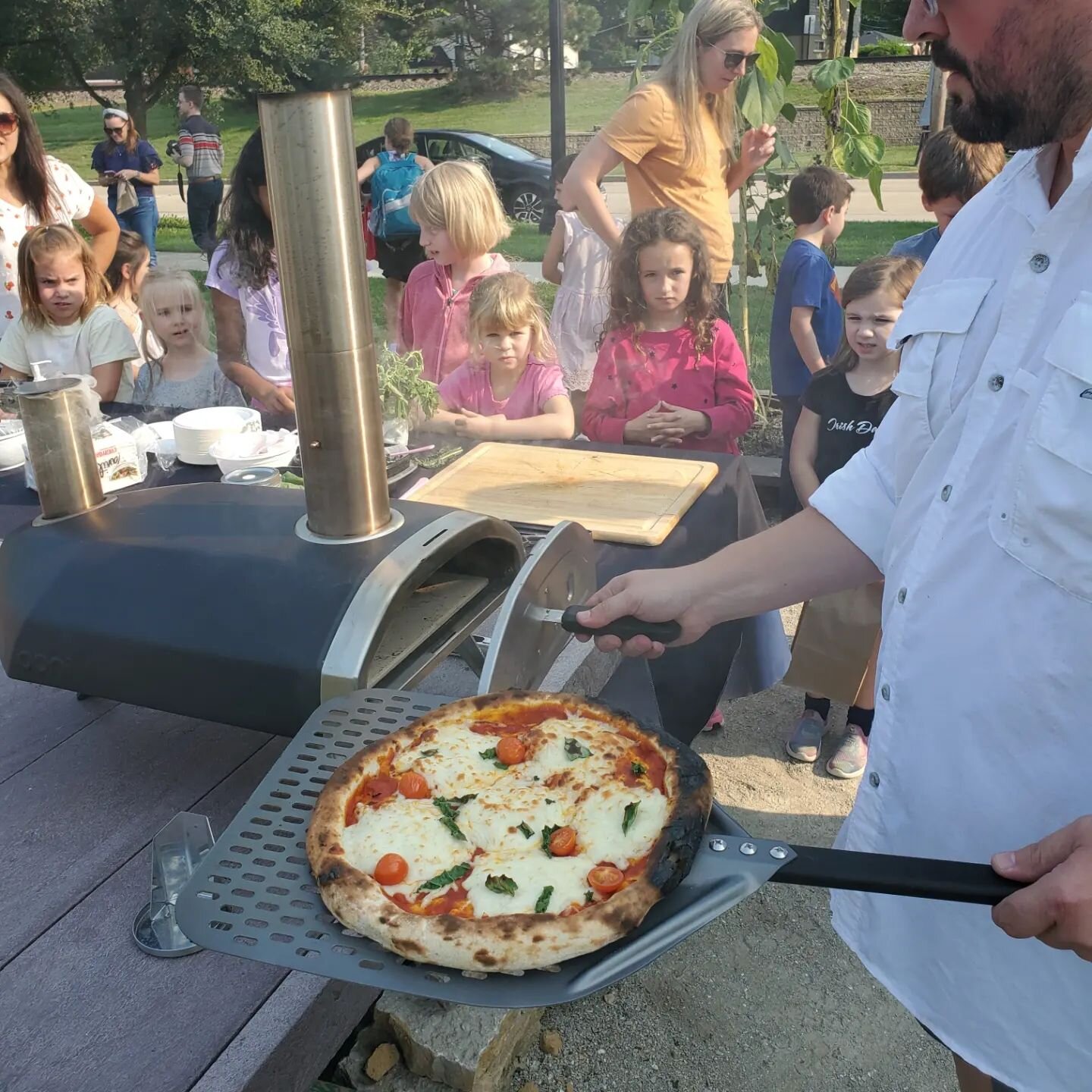 Thank you to @motherssourdoughpizza for joining us at our first &quot;Friends of the Garden&quot; meeting. The kids did great helping clean and harvest and Mike and Jen Prim were the highlight with their sourdough pizza. The kids had a blast!