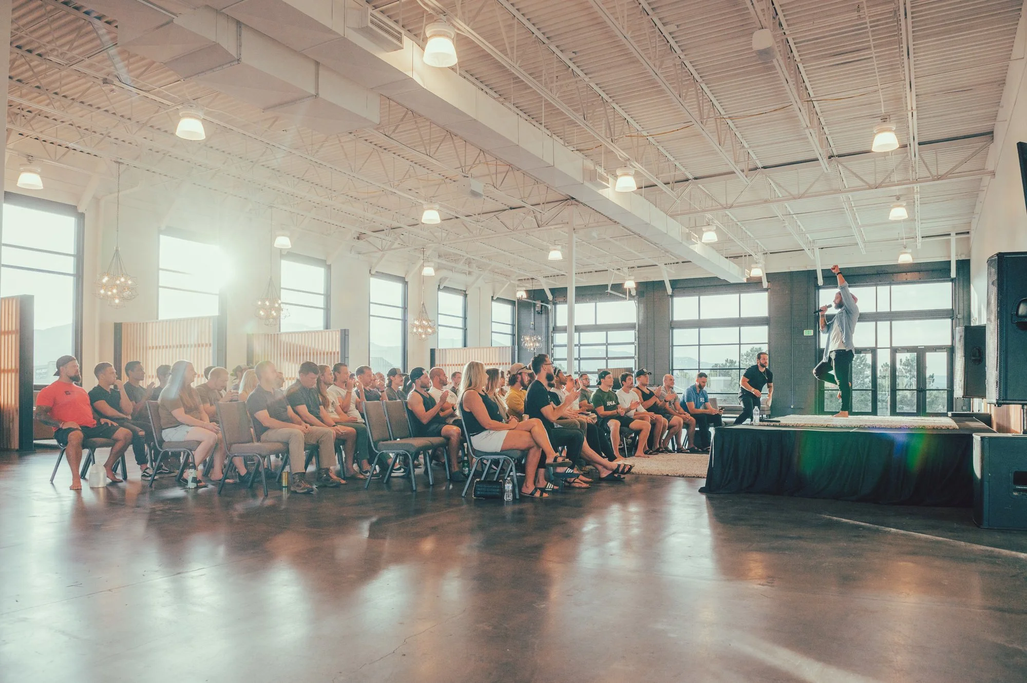 Guests gathered for a live event in a light-filled venue