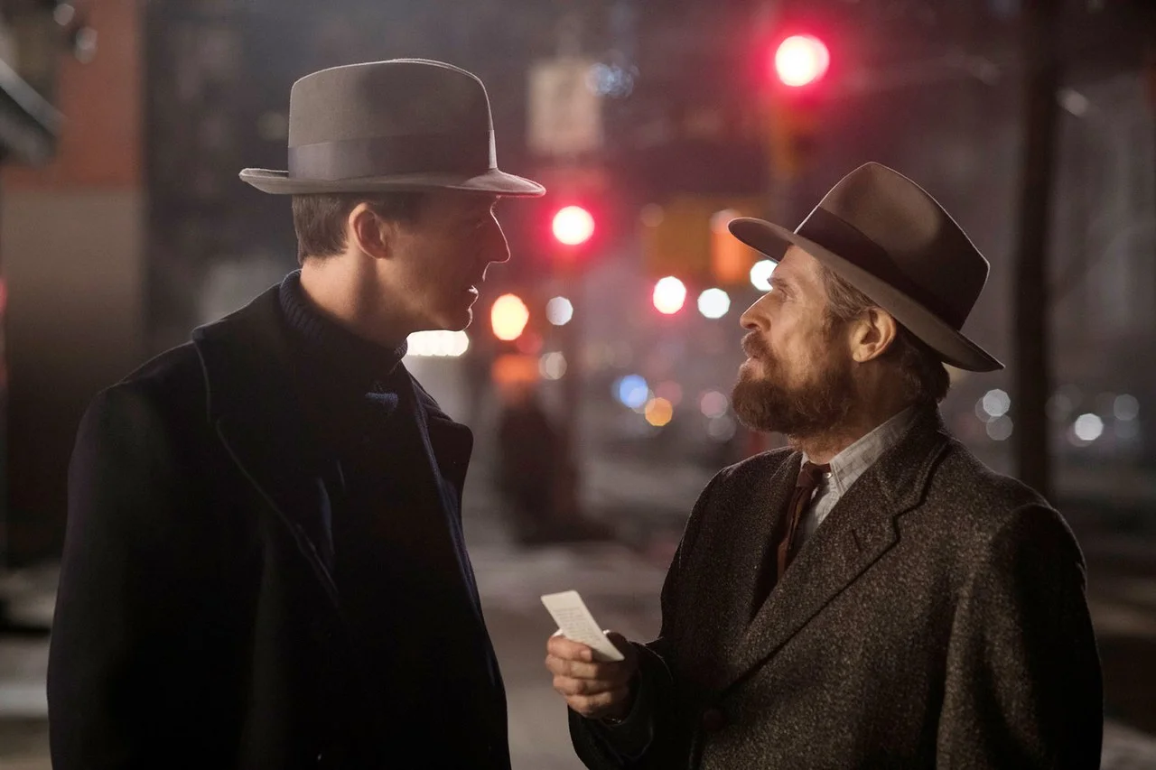 Edward Norton as Lionel Essrog and Willem Dafoe as Paul. Norton describes Paul as “the Jedi knight in rags.”
