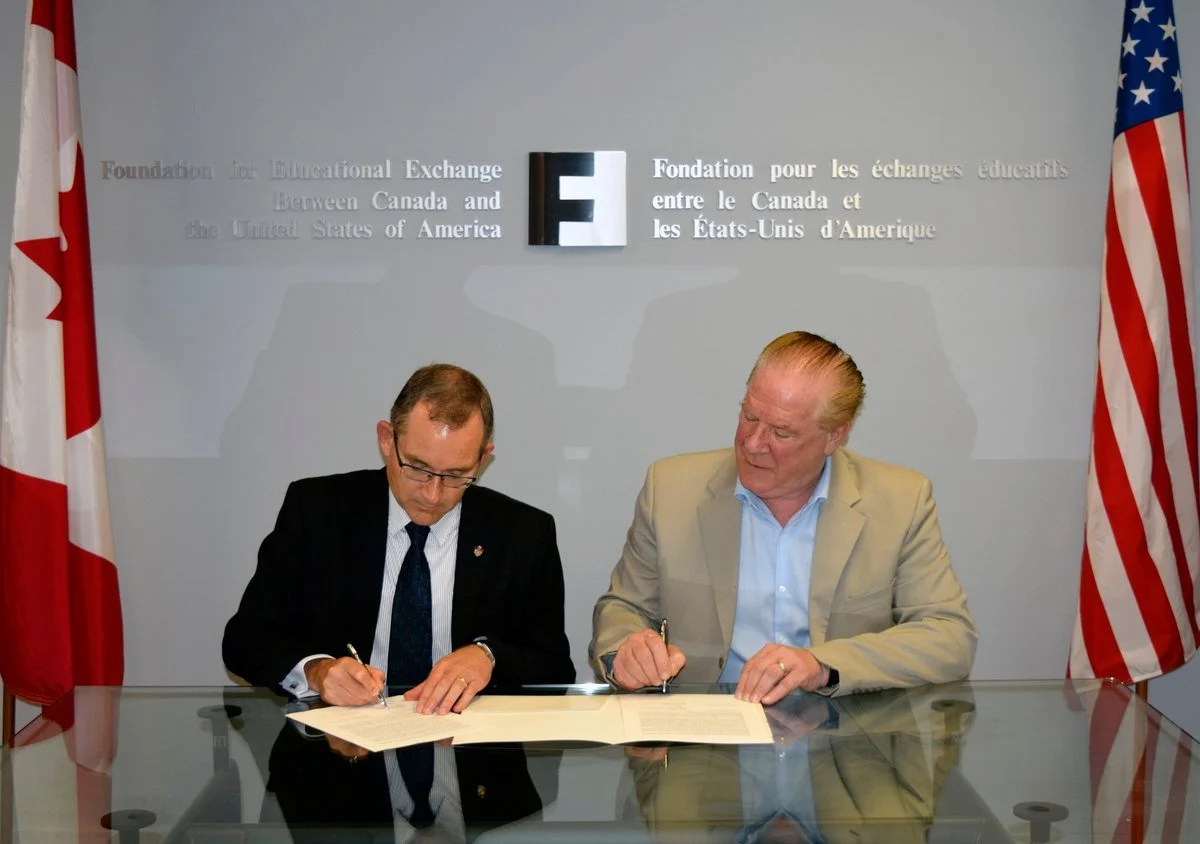 Dr. Summerby-Murray and Dr. Michael Hawes, CEO of Fulbright Canada, sign an MOU in Ottawa on September 18.