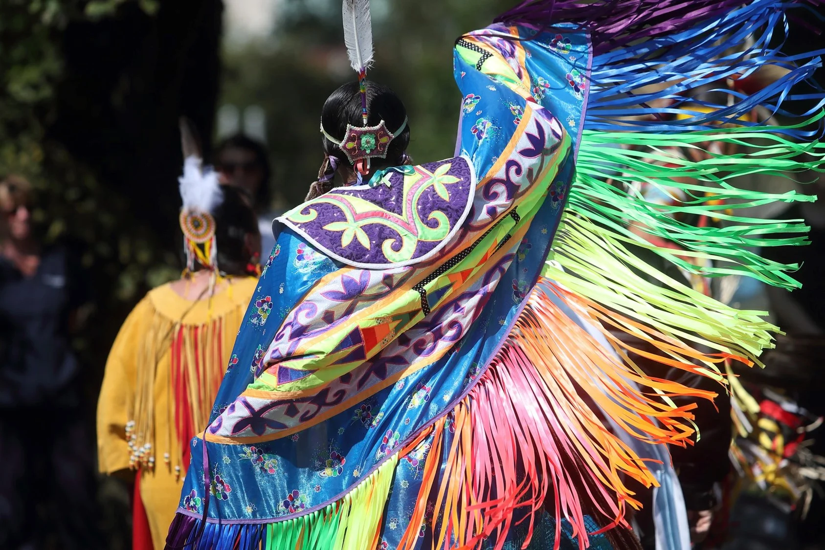 Above: A jingle dancer participates in the Mawiomi during 2018 Welcome Weeks.