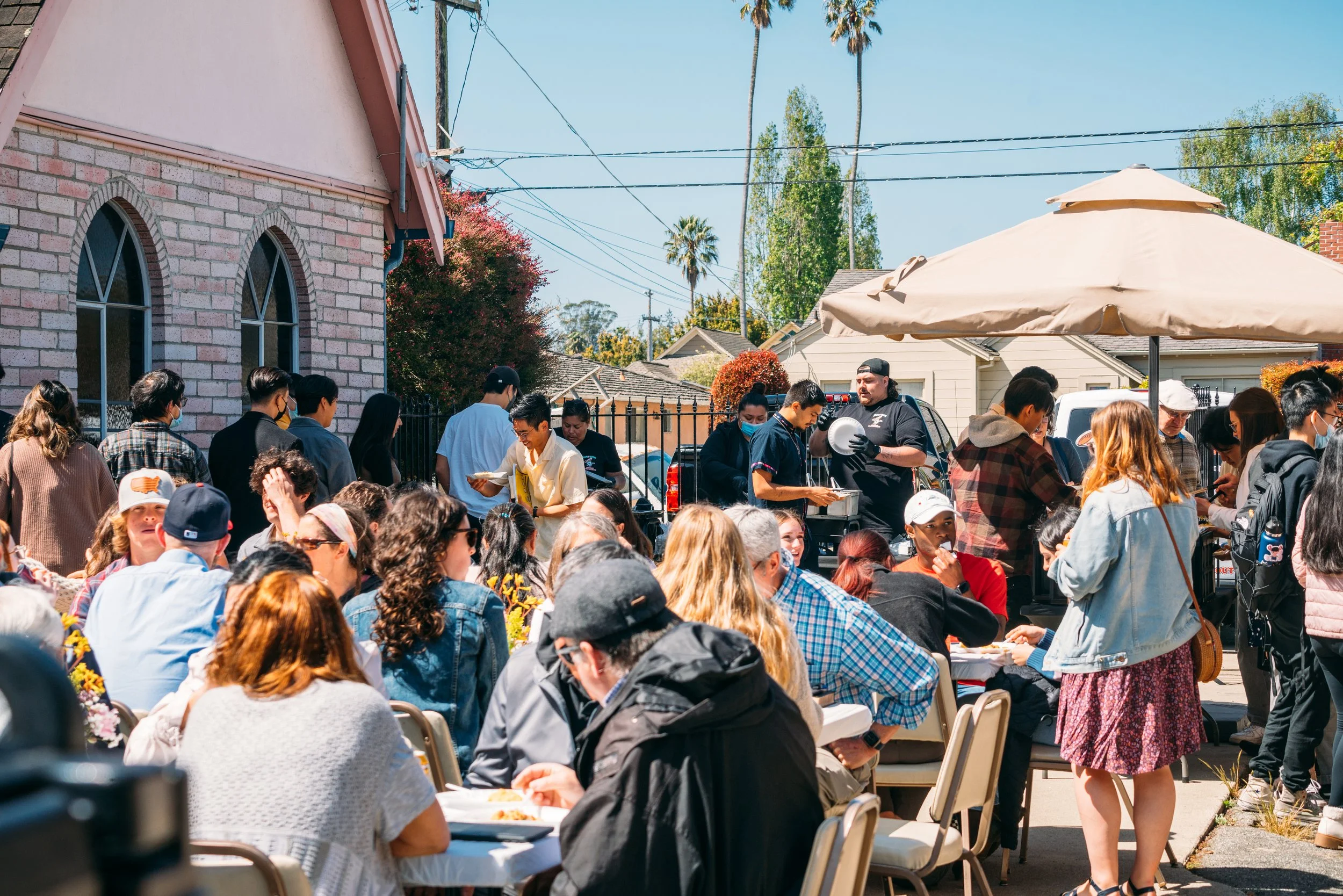 People enjoying fellowship and food after Gospel Community Church's Easter service in Santa Cruz, CA.