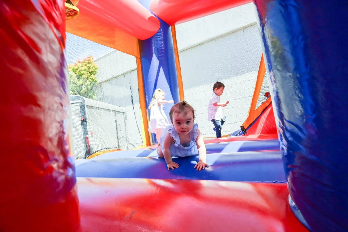 A child crawls in a bounce house at Gospel Community Church's Easter service in Santa Cruz, CA.