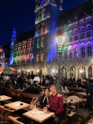 brussels grand place at night buildings multi-color rainbow evening