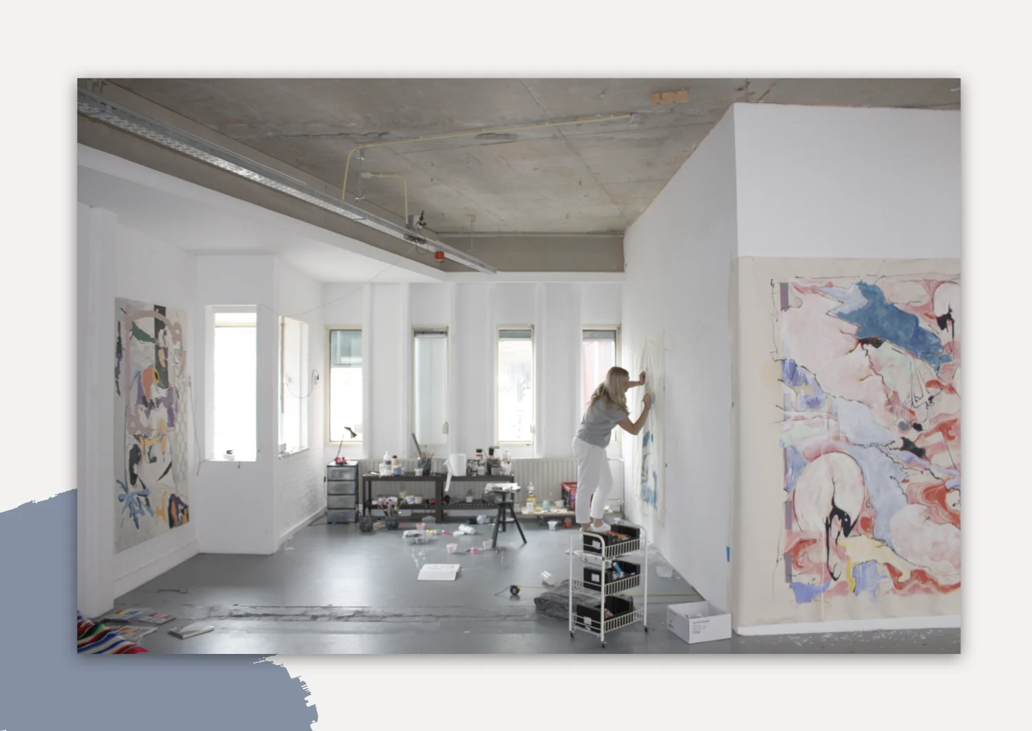 Meg Forsyth painting in her studio in the Netherlands