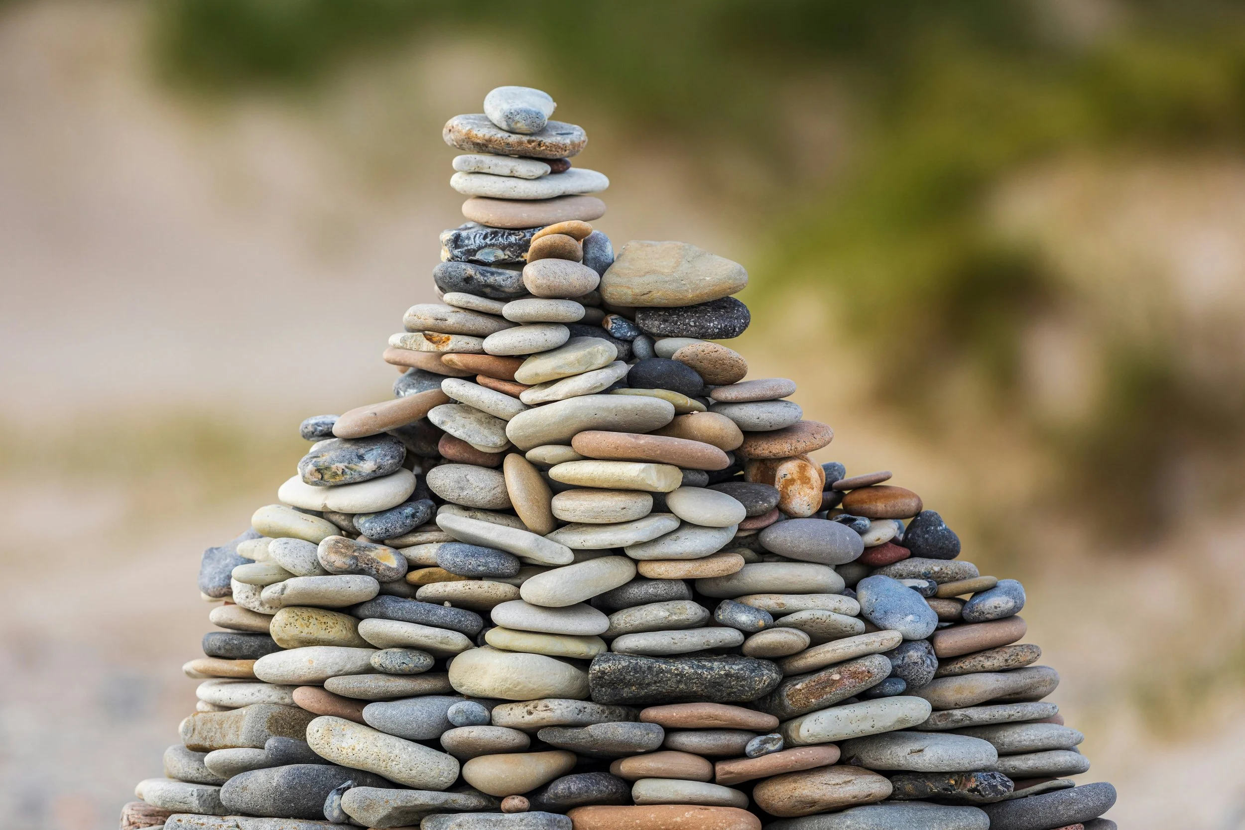 a stack of rock representing the process of rebuilding self trust as an autistic adult. Search therapy for autistic neurodivergent adults in Los Angeles