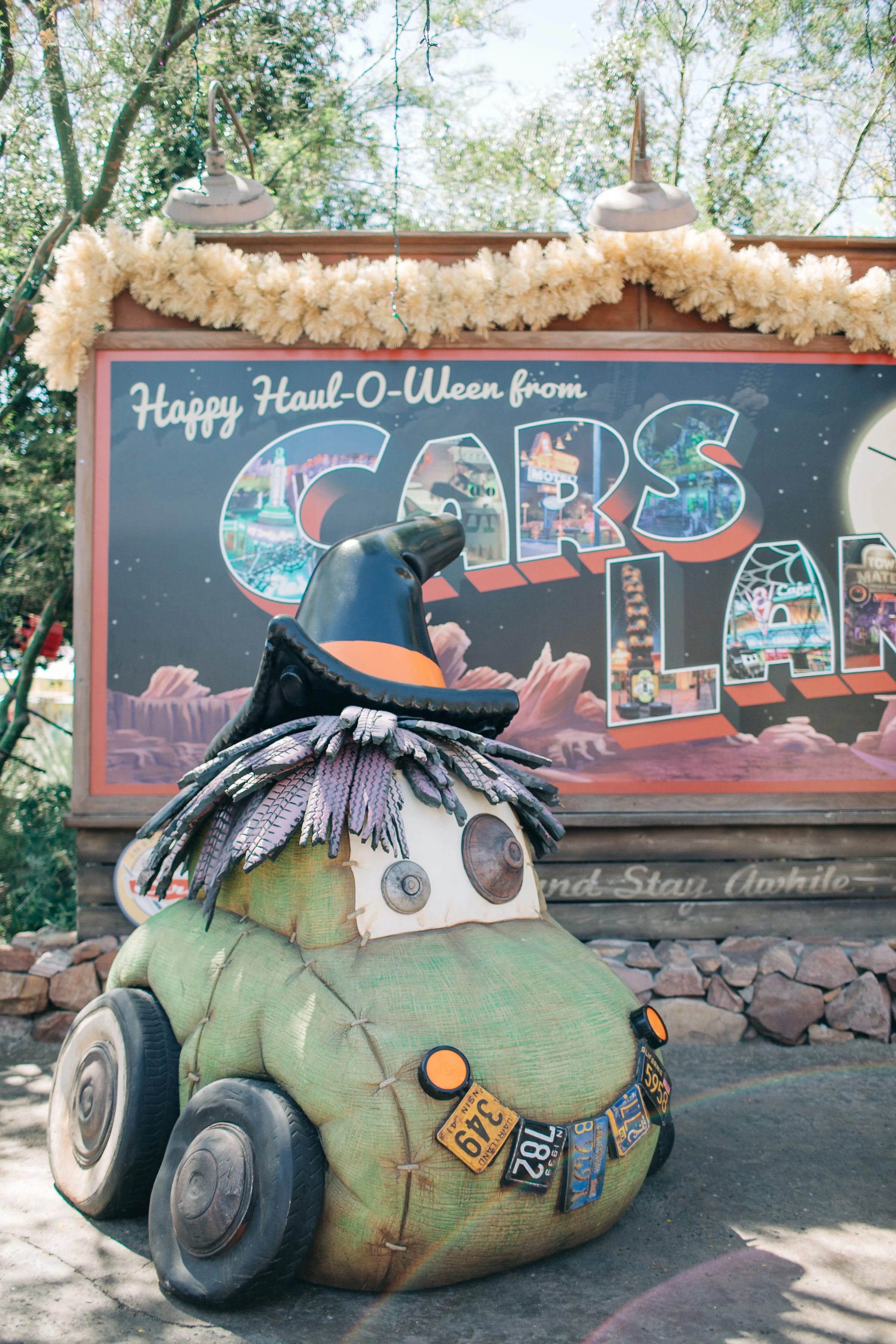 Our favorite place to visit during Halloween Time is Cars Land at Disney California Adventure Park! I love that every festive detail is done using car items. The best is the PumpCAN patch made with gas canisters painted to look like pumpkins. You can see them below…