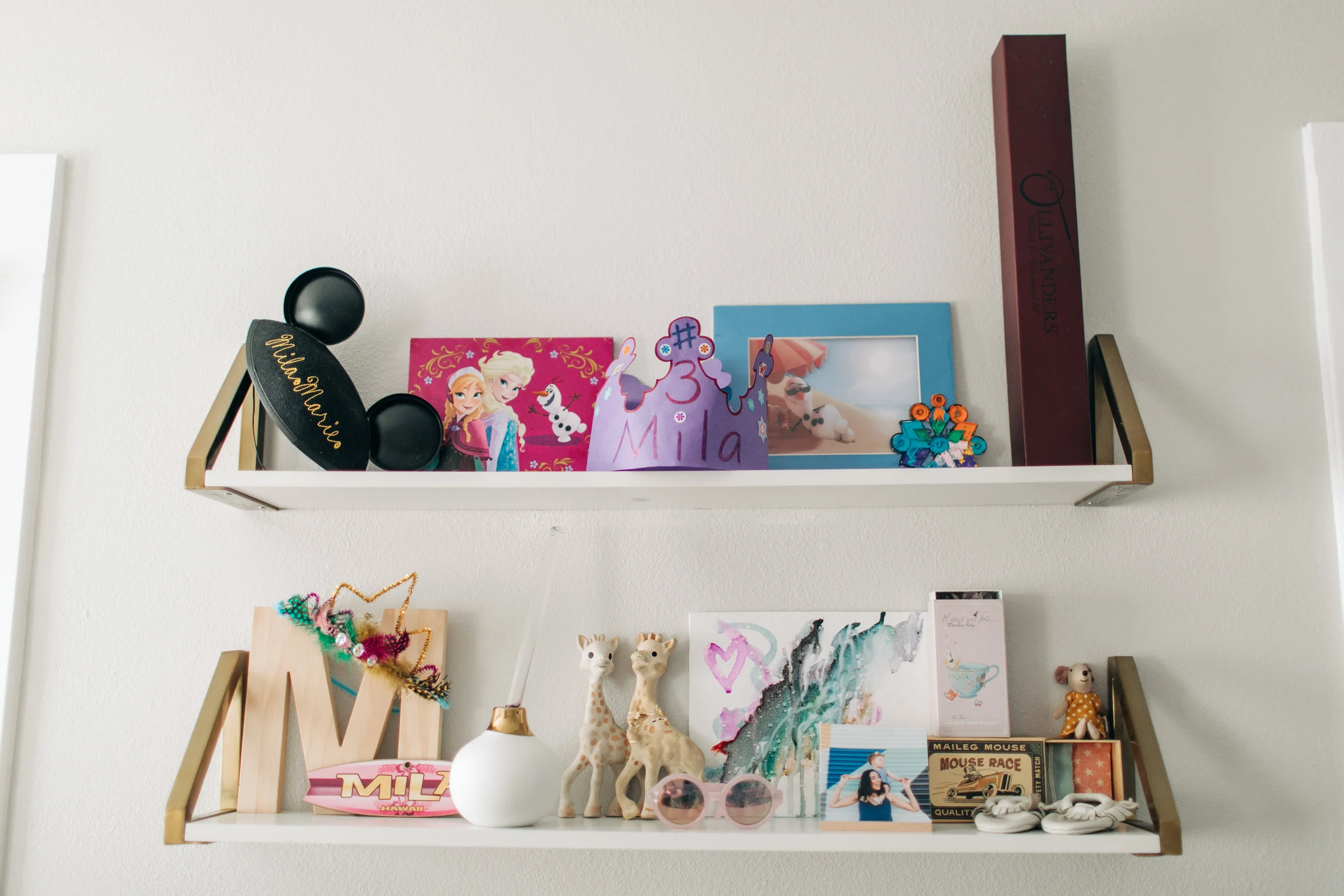 These are Mila’s shelves that are hung above her dress up area. It has changed a ton since her nursery days.