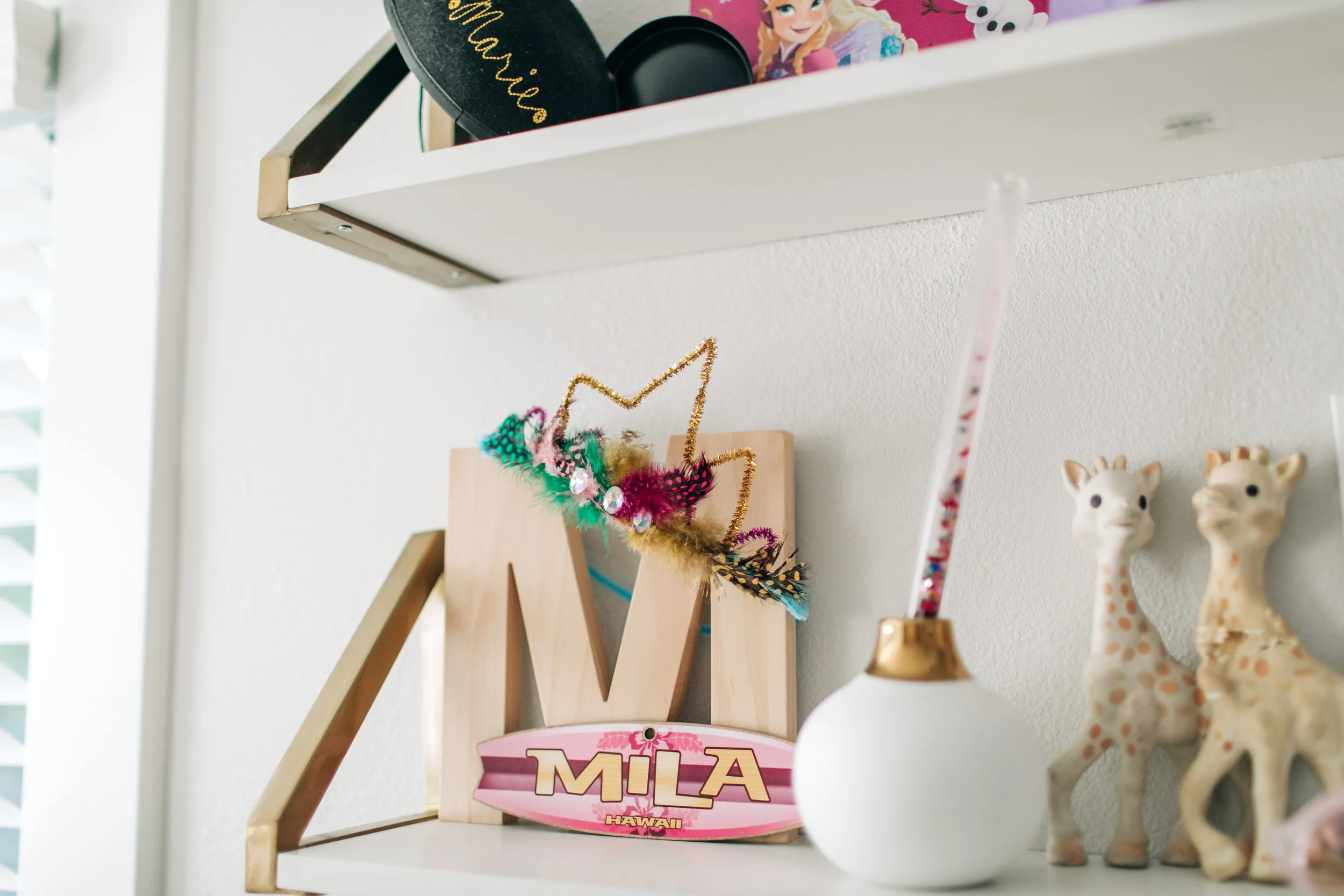 That pipe cleaner crown was from a craft shoot we did for our blog last year. The surfboard Mila name tag was a gift from her Aunt.