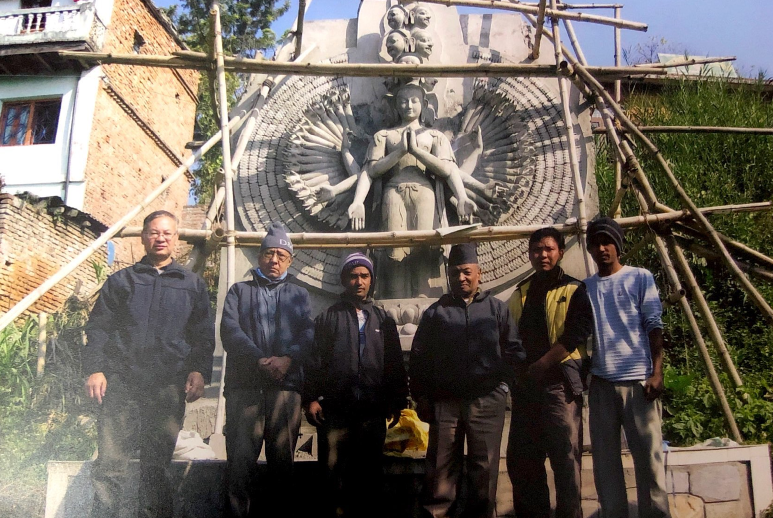 Yagya Man Pati Bajrachrya and his team during reconstruction of a temple in Thimi