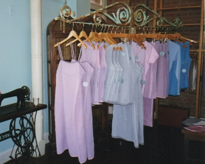 The boutique's decor was an eclectic mix of antique fixtures, vintage finds, and the designer's own family heirloom, an old Singer sewing machine owned by her Great Grandfather. Today the sewing machine graces the entry way of the designer's Pacific Palisades home.