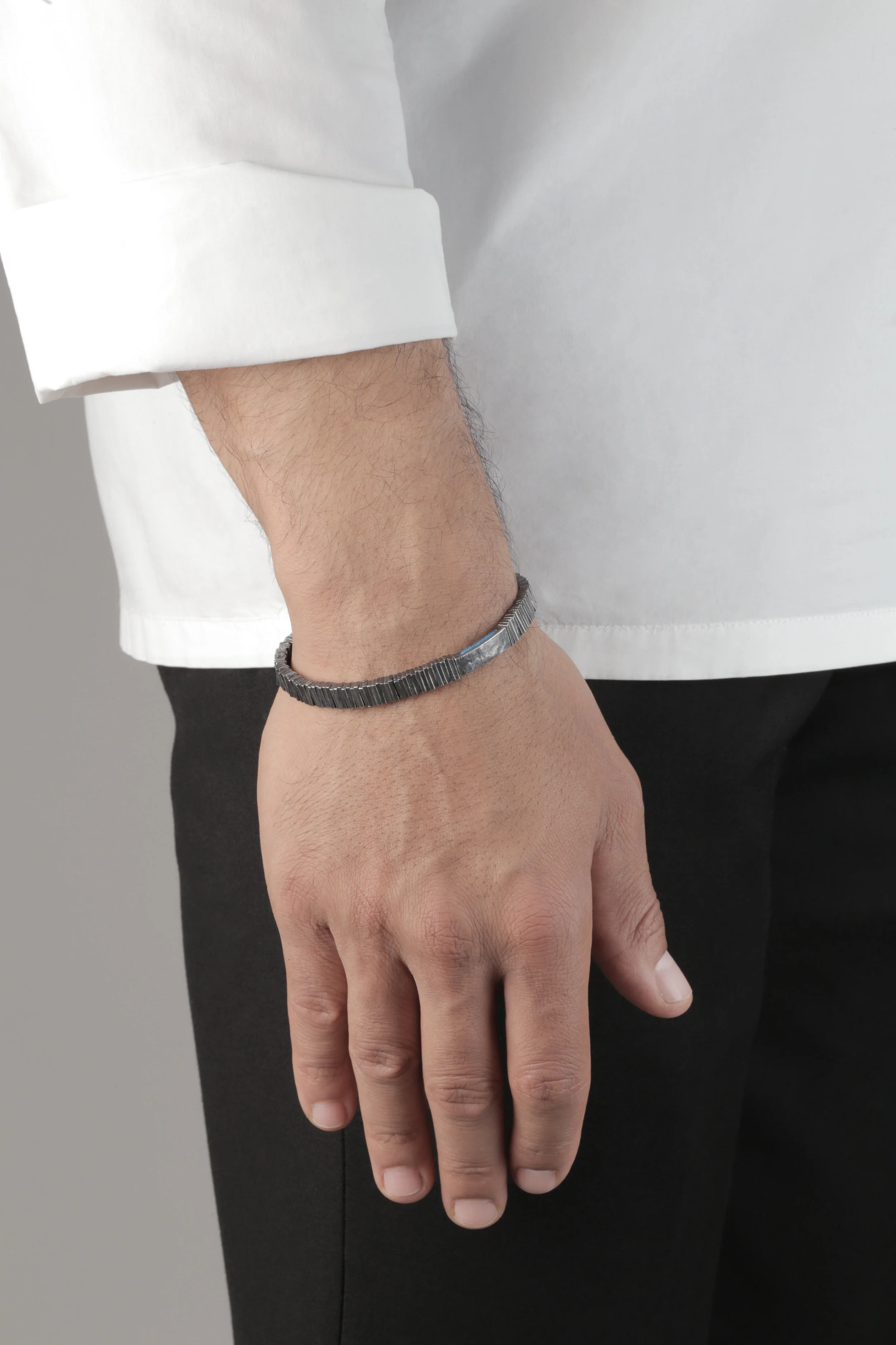 The carved vynil bracelet_blue_hand.jpg