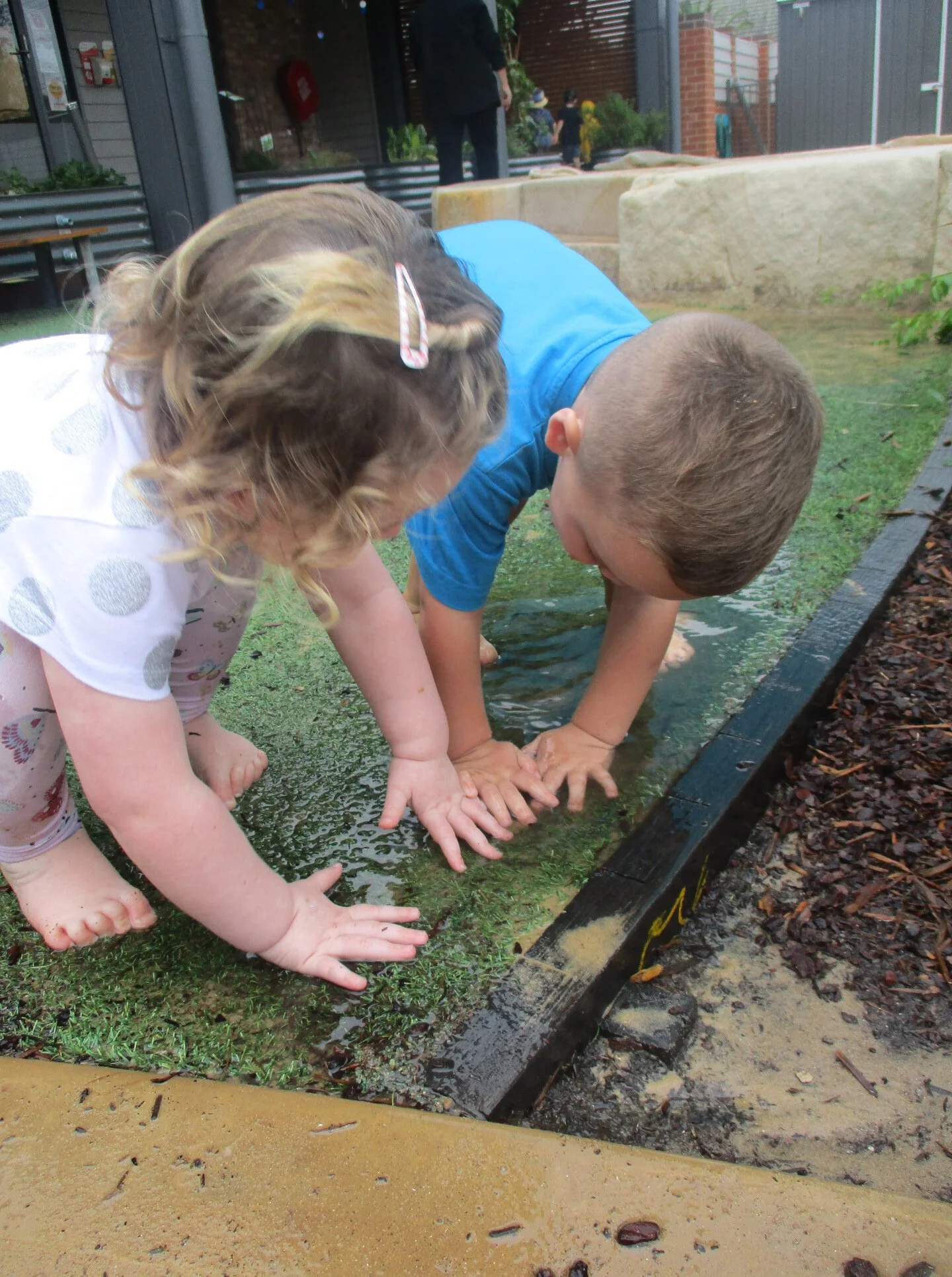 Lochinvar children are making the most of the rainy weather St