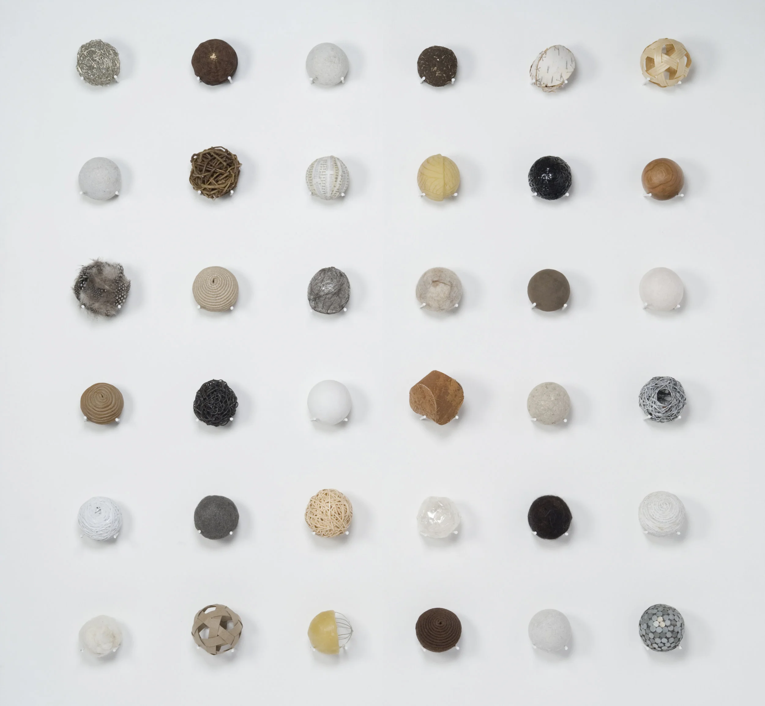   Untitled (Spheres)  36 assorted material studies 48" x 48" x 3" 2011 