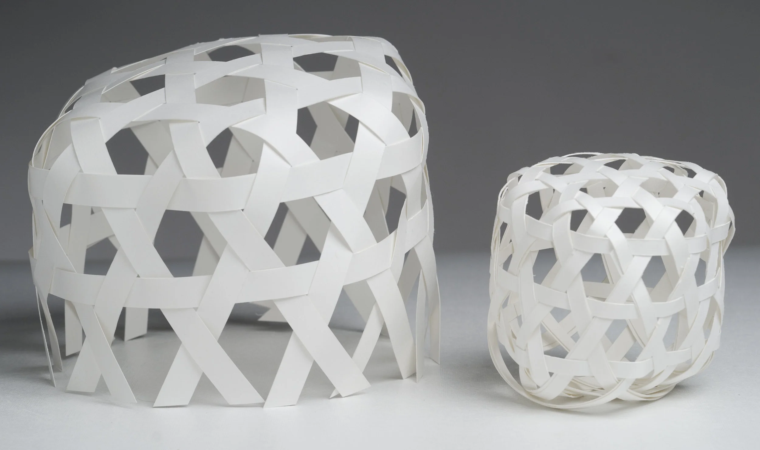   Hexagonal Plaiting Studies  paper (L) 8" x 8" x 6" (R) 4" x 4" x 5.5" 2010 